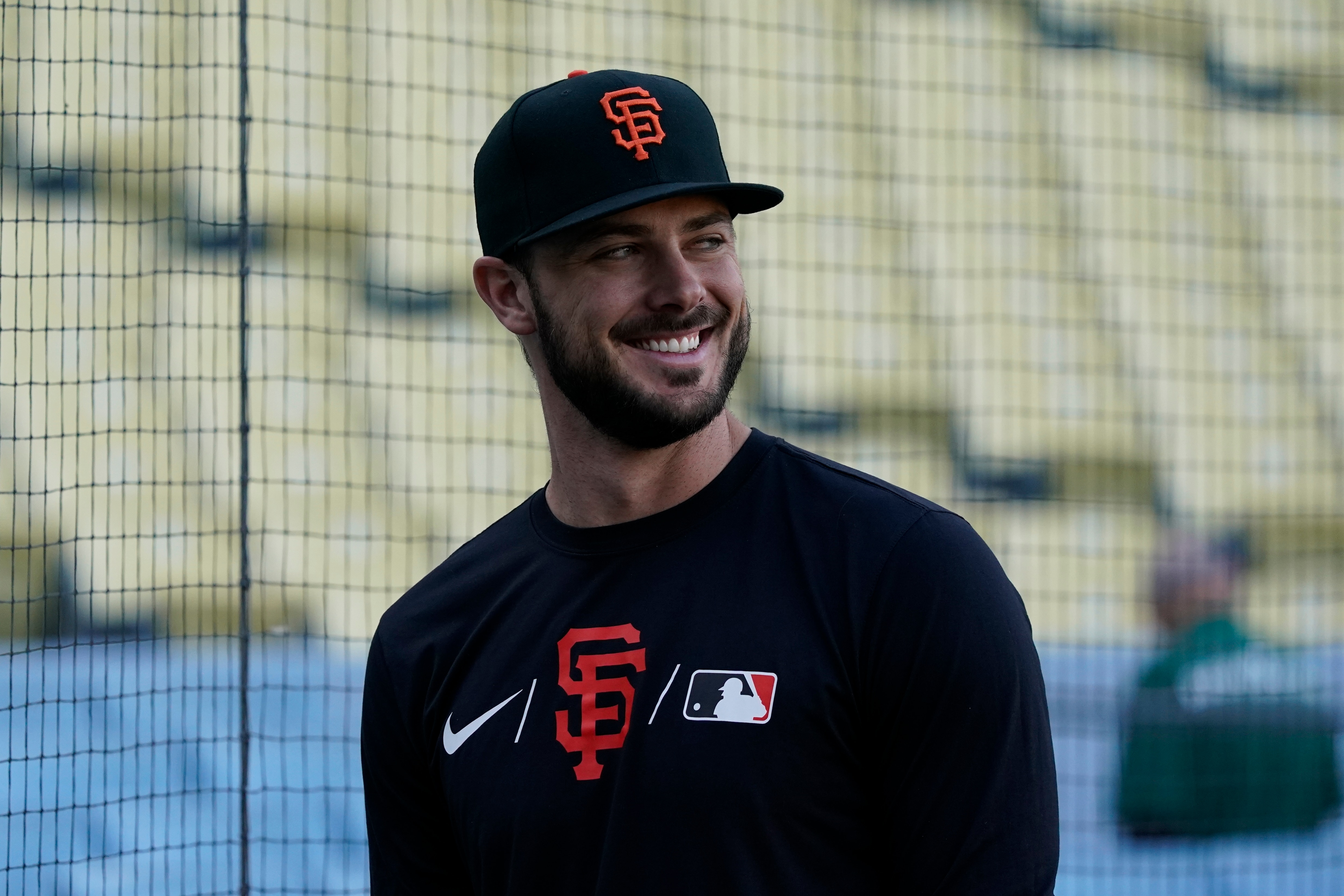 San Francisco Giants first baseman Kris Bryant stands near the cage during batting practice before Game 4 of a baseball National League Division Series against the Los Angeles Dodgers, Tuesday, Oct. 12, 2021, in Los Angeles. (AP Photo/Marcio Jose Sanchez)
