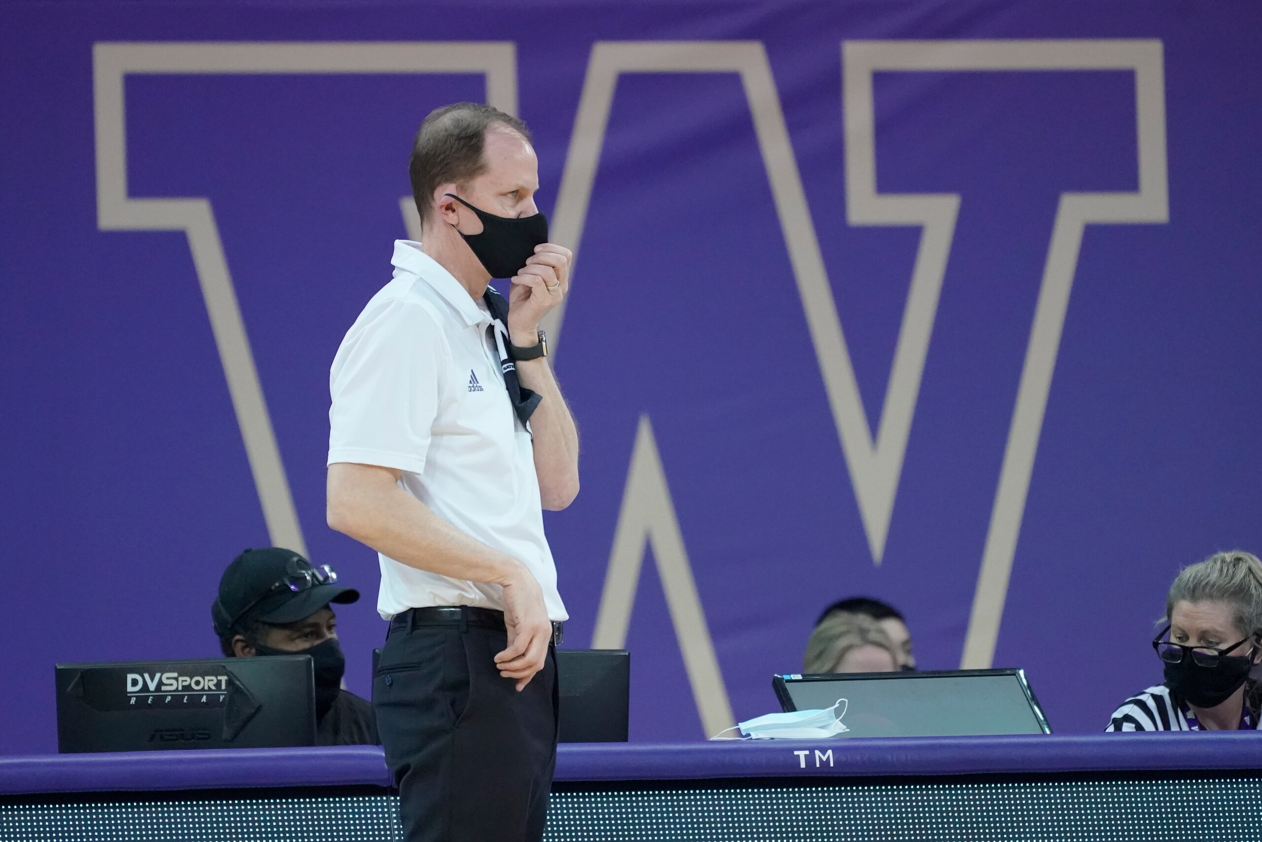 Washington head coach Mike Hopkins watches from the bench during an NCAA college basketball game against California, Saturday, Feb. 20, 2021, in Seattle. (AP Photo/Ted S. Warren)