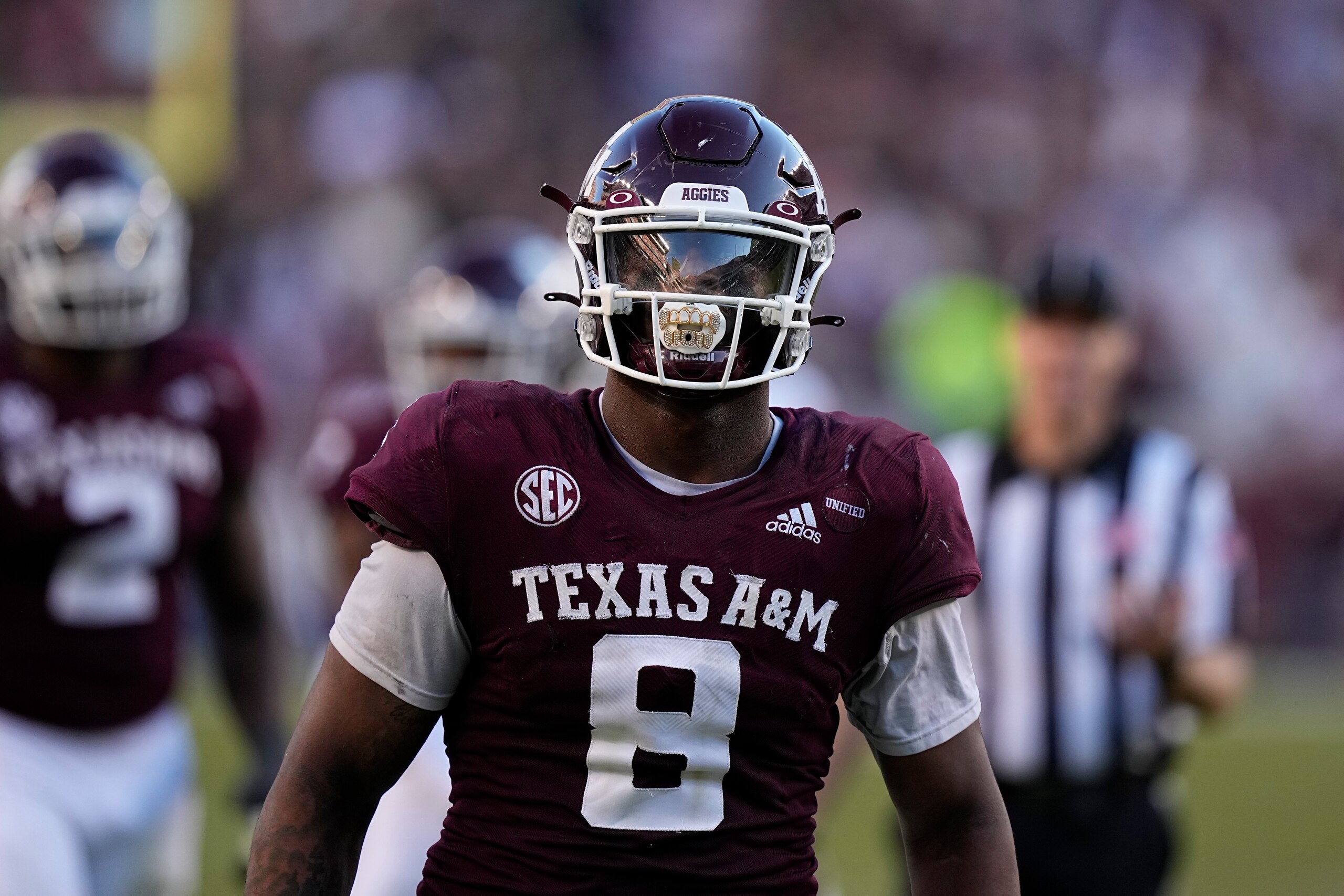 Texas A&M defensive lineman DeMarvin Leal (8) reacts the ball after a play against Auburn during the second half of an NCAA college football game Saturday, Nov. 6, 2021, in College Station, Texas. (AP Photo/David J. Phillip)