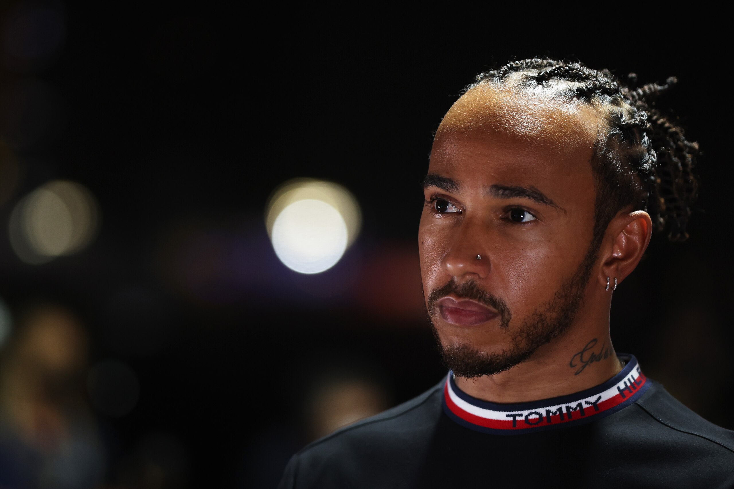 JEDDAH, SAUDI ARABIA - DECEMBER 02: Lewis Hamilton of Great Britain and Mercedes GP looks on in the Paddock during previews ahead of the F1 Grand Prix of Saudi Arabia at Jeddah Corniche Circuit on December 02, 2021 in Jeddah, Saudi Arabia. (Photo by Mark Thompson/Getty Images)