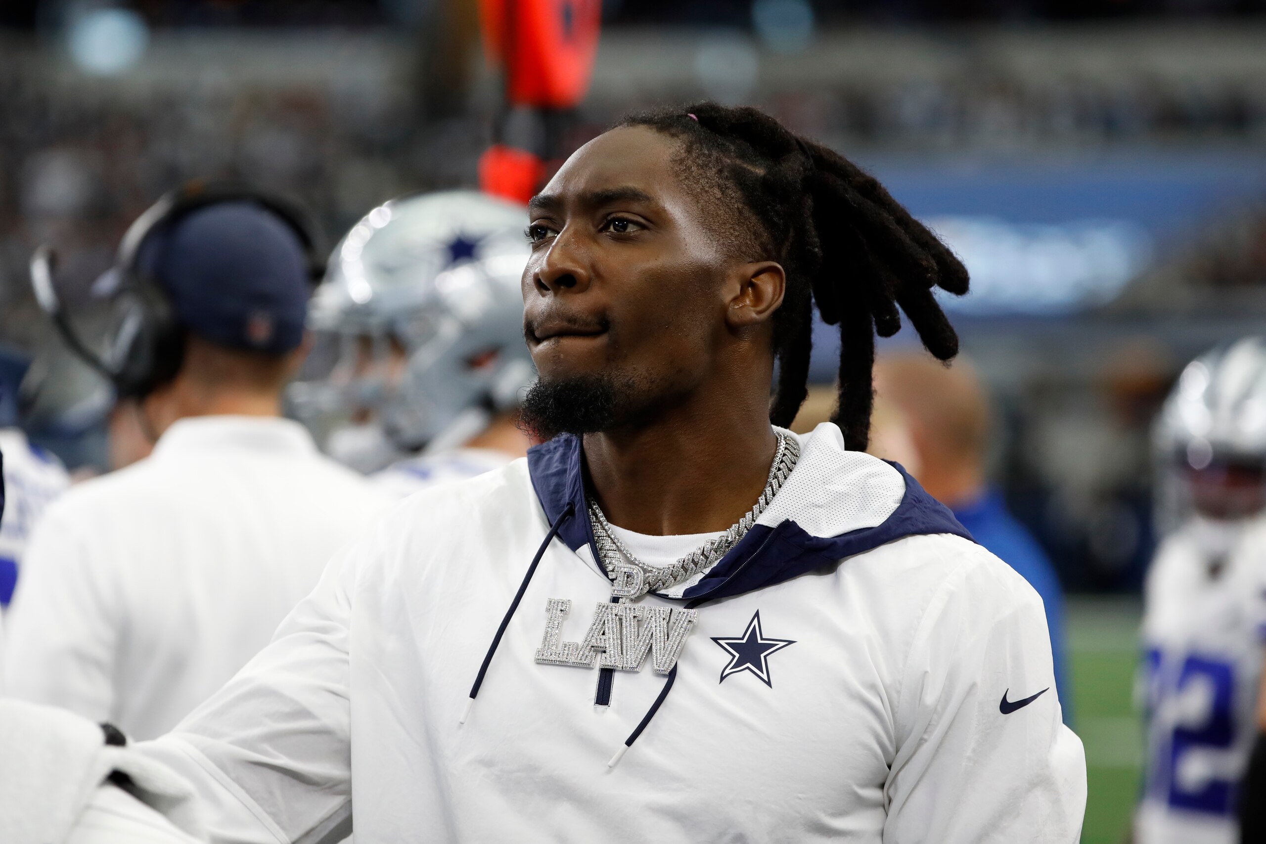 Dallas Cowboys defensive end DeMarcus Lawrence watches play from the sideline during the first half of an NFL football game against the Atlanta Falcons in Arlington, Texas, Sunday, Nov. 14, 2021. (AP Photo/Roger Steinman)