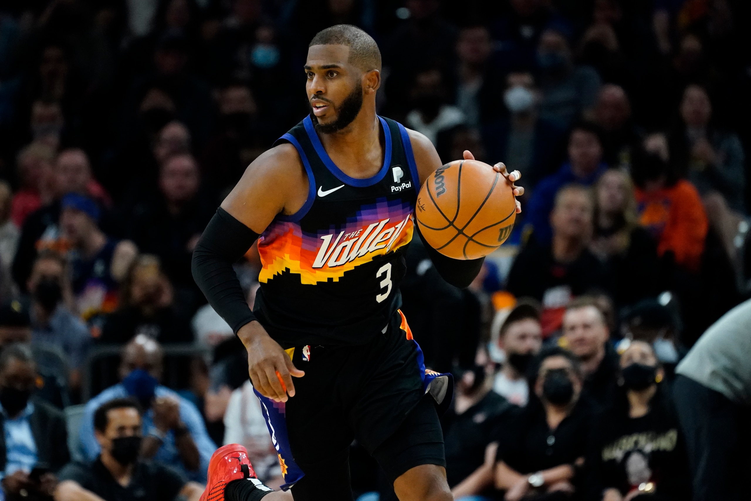 Phoenix Suns guard Chris Paul (3) against the Golden State Warriors during the second half of an NBA basketball game, Tuesday, Nov. 30, 2021, in Phoenix. (AP Photo/Matt York)