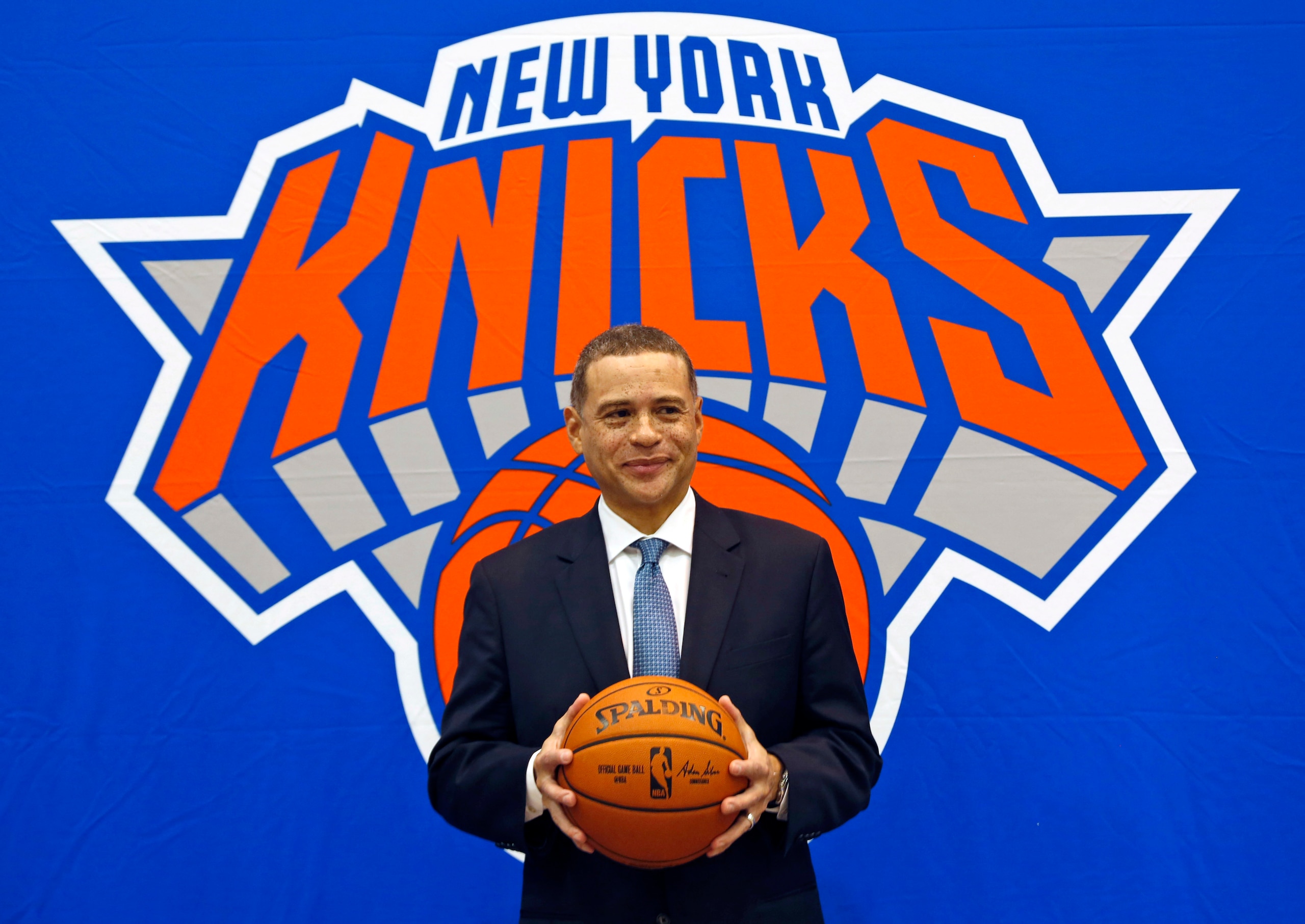 FILE - In this July 17, 2017, file photo, New York Knicks general manager Scott Perry poses for a picture after a news conference in Greenburgh, N.Y. Scott Perry will remain general manager of the New York Knicks after agreeing to a new one-year deal with the team Wednesday, April 29, 2020. (AP Photo/Seth Wenig, File) FILE - In this July 17, 2017, file photo, New York Knicks general manager Scott Perry poses for a picture after a news conference in Greenburgh, N.Y. Scott Perry will remain general manager of the New York Knicks after agreeing to a new one-year deal with the team Wednesday, April 29, 2020. (AP Photo/Seth Wenig, File)