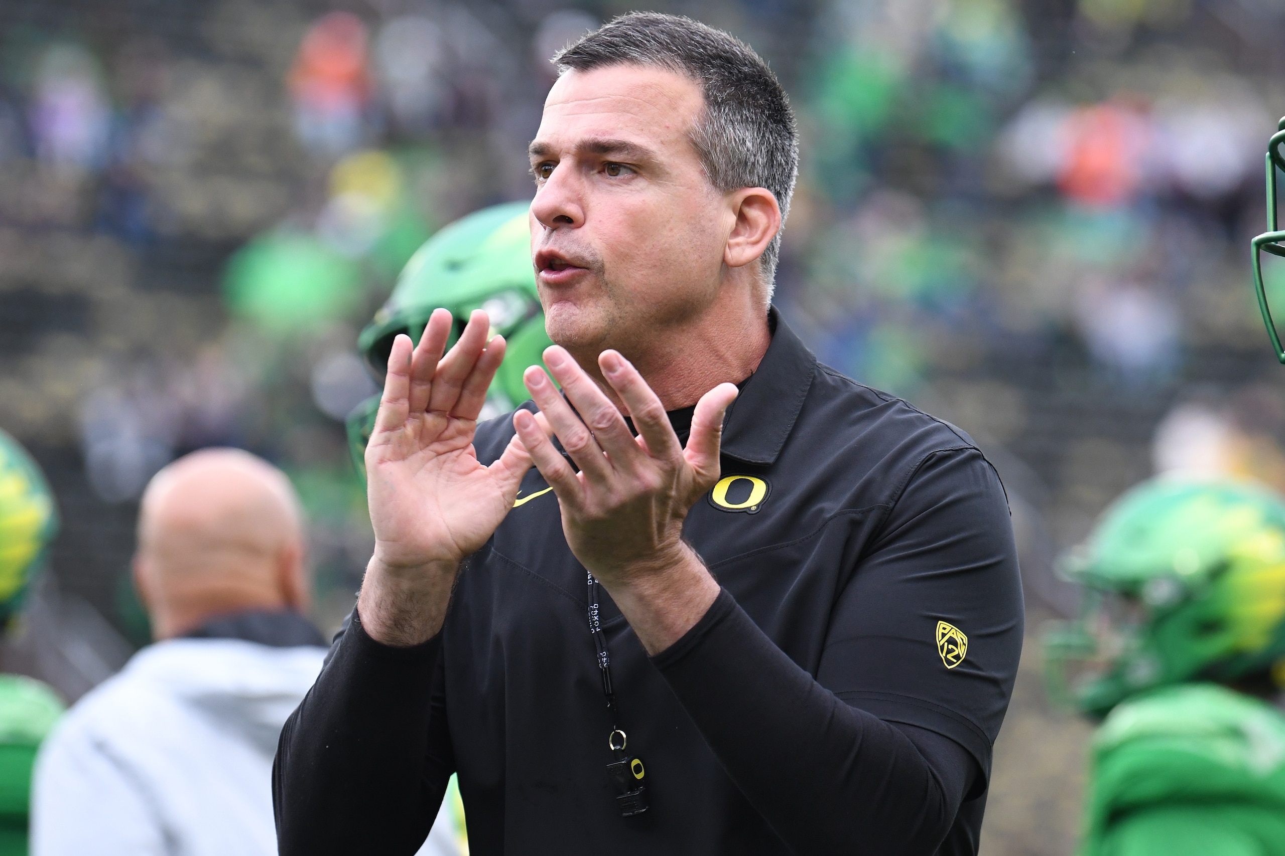 EUGENE, OR - NOVEMBER 27: Oregon Ducks head coach Mario Cristobal oversees pre-game drills during a PAC-12 conference football game between the Oregon State Beavers and Oregon Ducks on November 27, 2021 at Autzen Stadium in Eugene, Oregon. (Photo by Brian Murphy/Icon Sportswire via Getty Images)