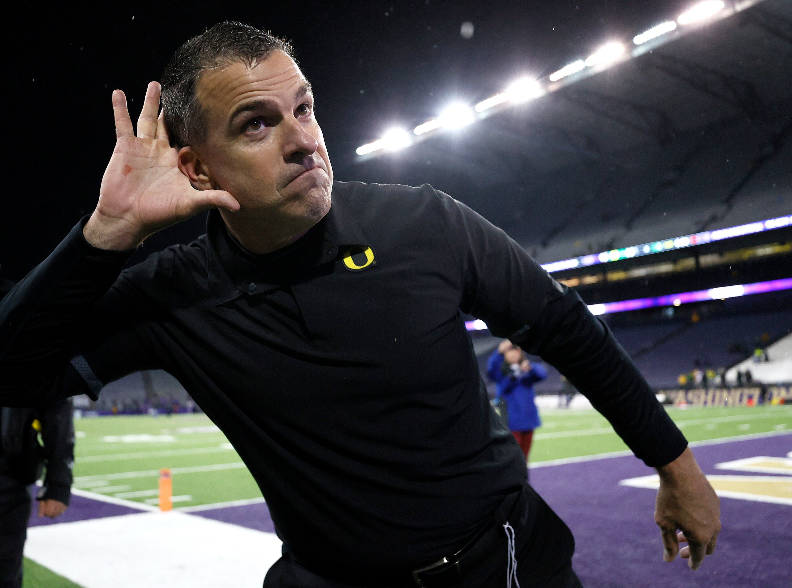 SEATTLE, WASHINGTON - NOVEMBER 06: Head coach Mario Cristobal of the Oregon Ducks celebrates after beating Washington Huskies 26-16 at Husky Stadium on November 06, 2021 in Seattle, Washington. (Photo by Steph Chambers/Getty Images)