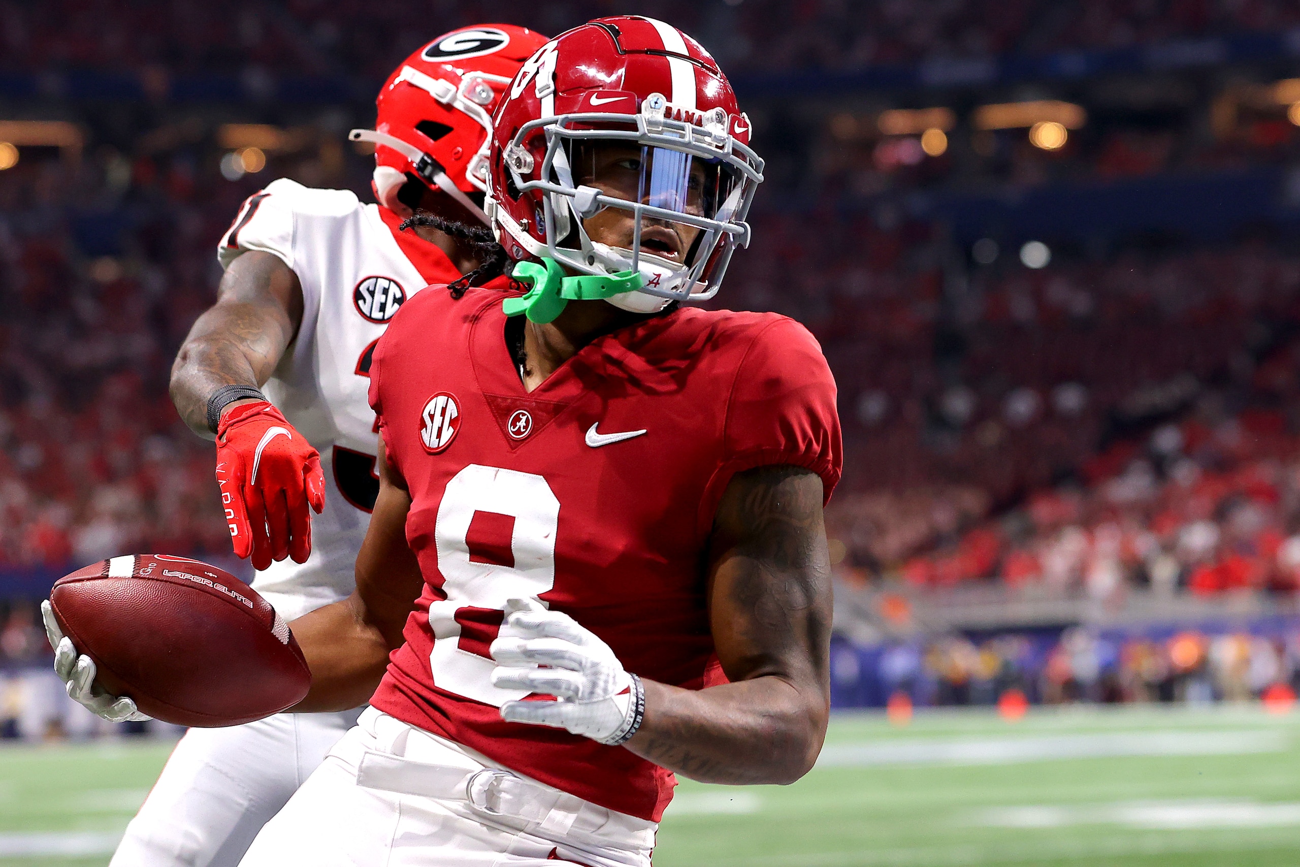 ATLANTA, GEORGIA - DECEMBER 04: John Metchie III #8 of the Alabama Crimson Tide catches the ball for a touchdown in the second quarter of the SEC Championship game against the Georgia Bulldogs at Mercedes-Benz Stadium on December 04, 2021 in Atlanta, Georgia. (Photo by Kevin C. Cox/Getty Images)