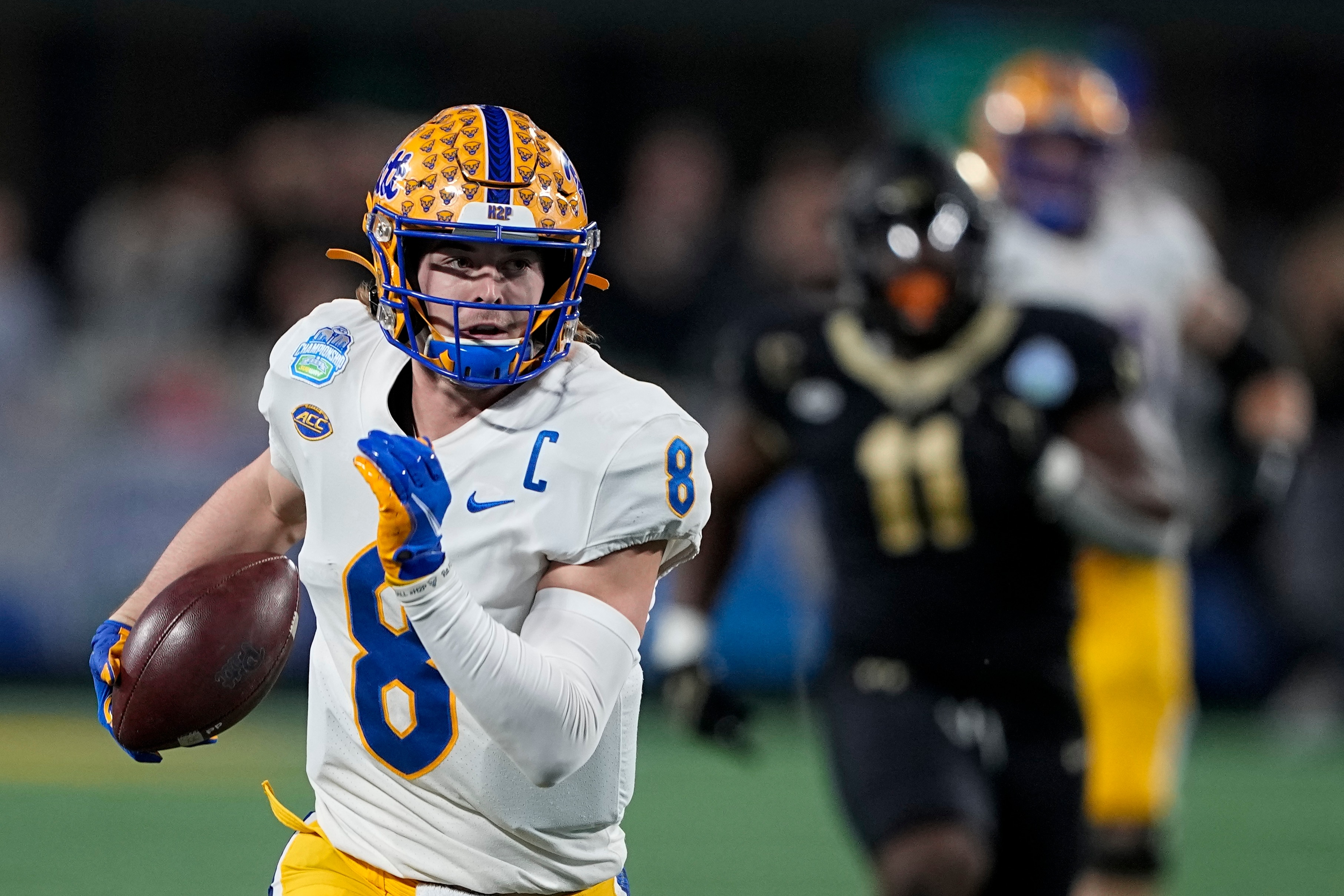 Pittsburgh quarterback Kenny Pickett runs for a touchdown during the first half of the Atlantic Coast Conference championship NCAA college football game against Wake Forest Saturday, Dec. 4, 2021, in Charlotte, N.C. (AP Photo/Chris Carlson)