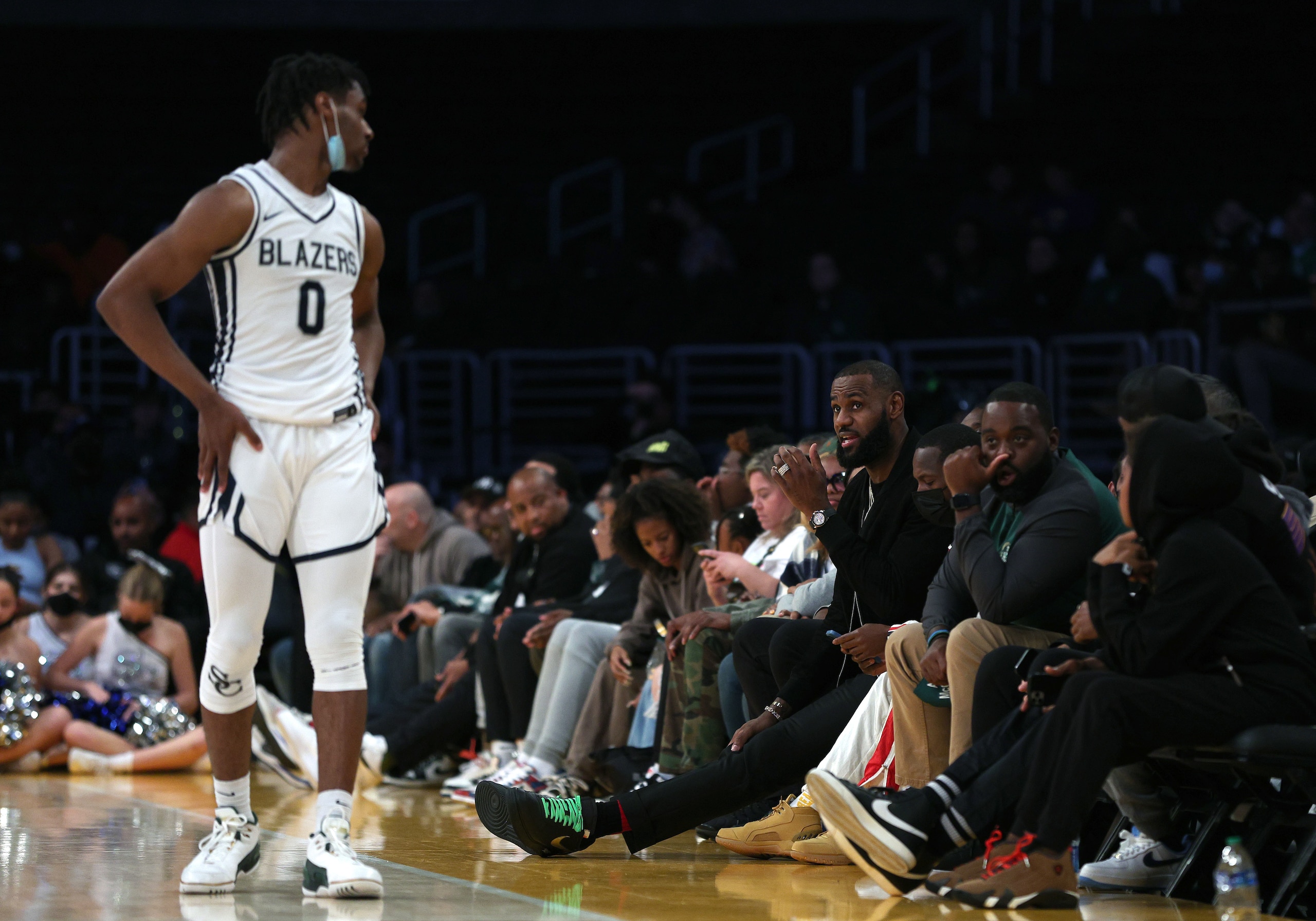LOS ANGELES, CALIFORNIA - DECEMBER 04: LeBron James #6 of the Los Angeles Lakers speaks to his son Bronny James #0 of Sierra Canyon during the game against St. Vincent - St. Mary during The Chosen-1's Invitational at Staples Center on December 04, 2021 in Los Angeles, California. (Photo by Harry How/Getty Images)