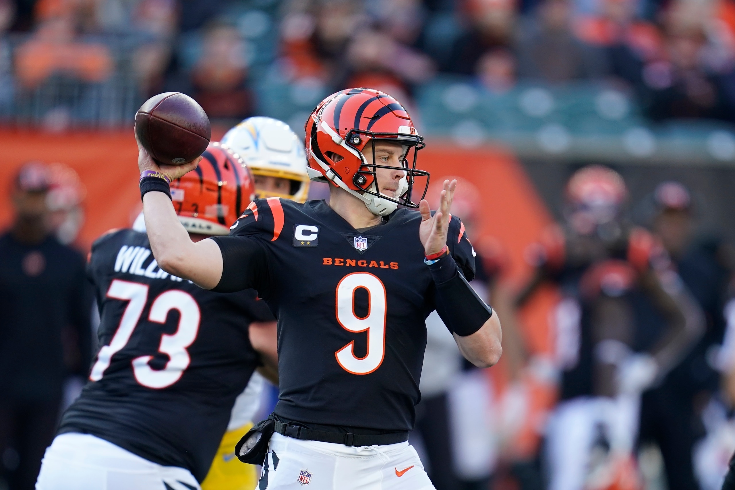 Cincinnati Bengals quarterback Joe Burrow (9) throws during the second half of an NFL football game against the Los Angeles Chargers, Sunday, Dec. 5, 2021, in Cincinnati. (AP Photo/Michael Conroy)