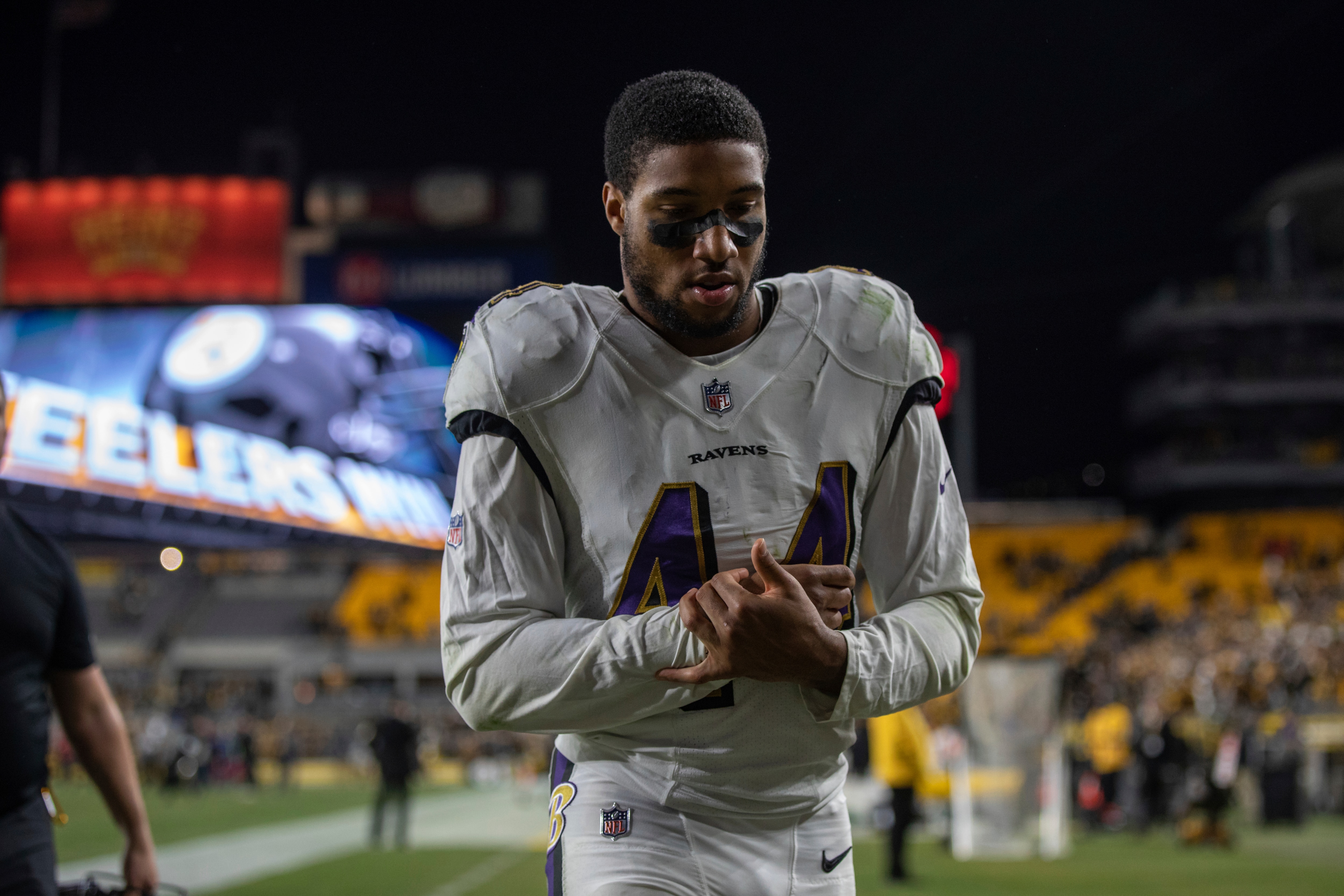 Baltimore Ravens cornerback Marlon Humphrey (44) holds his wrist while walking off the field after an NFL football game, Sunday, December 5, 2021 in Pittsburgh. (AP Photo/Matt Durisko)