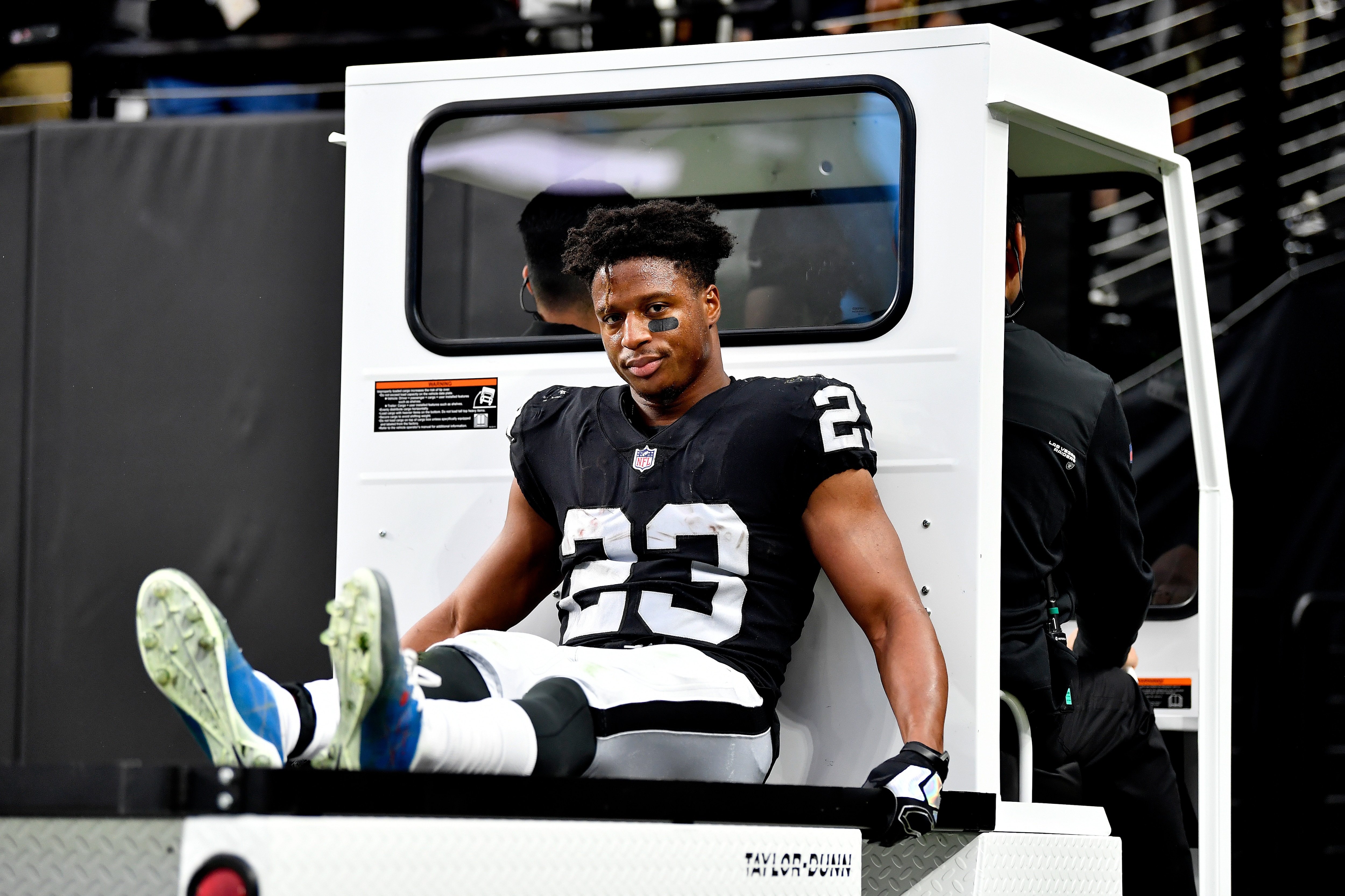 LAS VEGAS, NEVADA - DECEMBER 05: Kenyan Drake #23 of the Las Vegas Raiders is taken off he field on a cart during the second quarter of the game between the Washington Football Team and the Las Vegas Raiders at Allegiant Stadium on December 05, 2021 in Las Vegas, Nevada. (Photo by Chris Unger/Getty Images)
