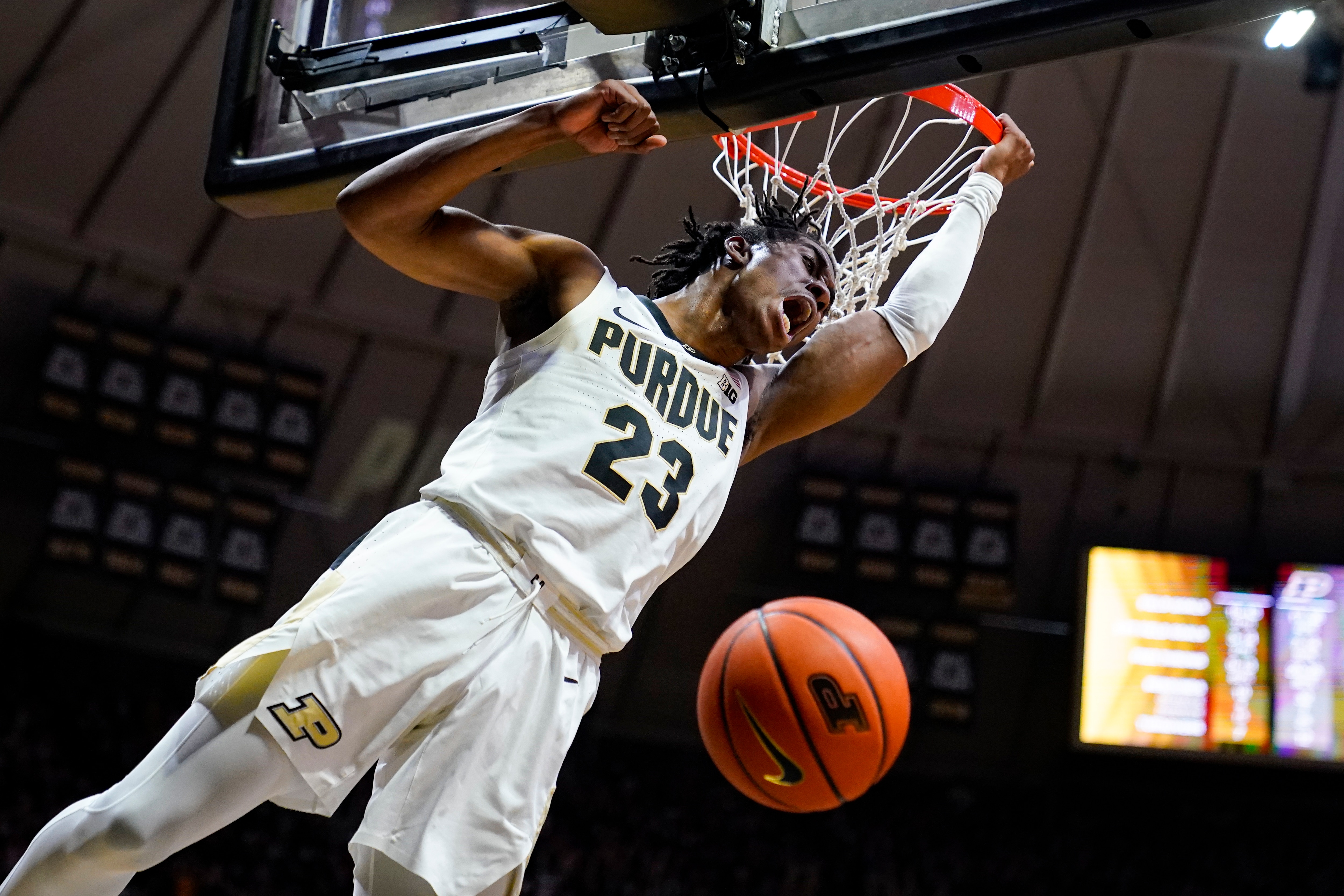 Purdue guard Jaden Ivey (23) reacts after a fast-break slam-dunk against Iowa during the second half of an NCAA college basketball game in West Lafayette, Ind., Friday, Dec. 3, 2021. (AP Photo/Michael Conroy)
