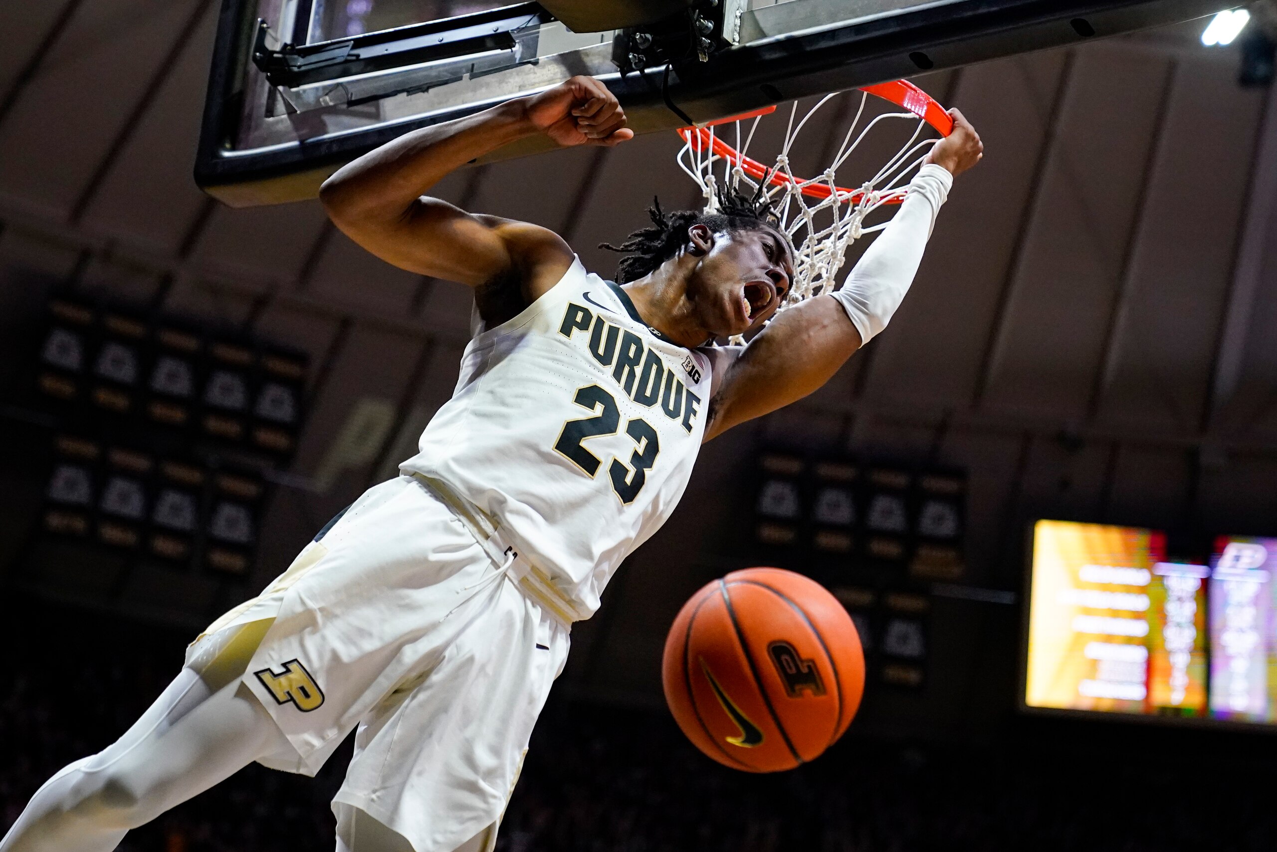 Purdue guard Jaden Ivey (23) reacts after a fast-break slam-dunk against Iowa during the second half of an NCAA college basketball game in West Lafayette, Ind., Friday, Dec. 3, 2021. (AP Photo/Michael Conroy)