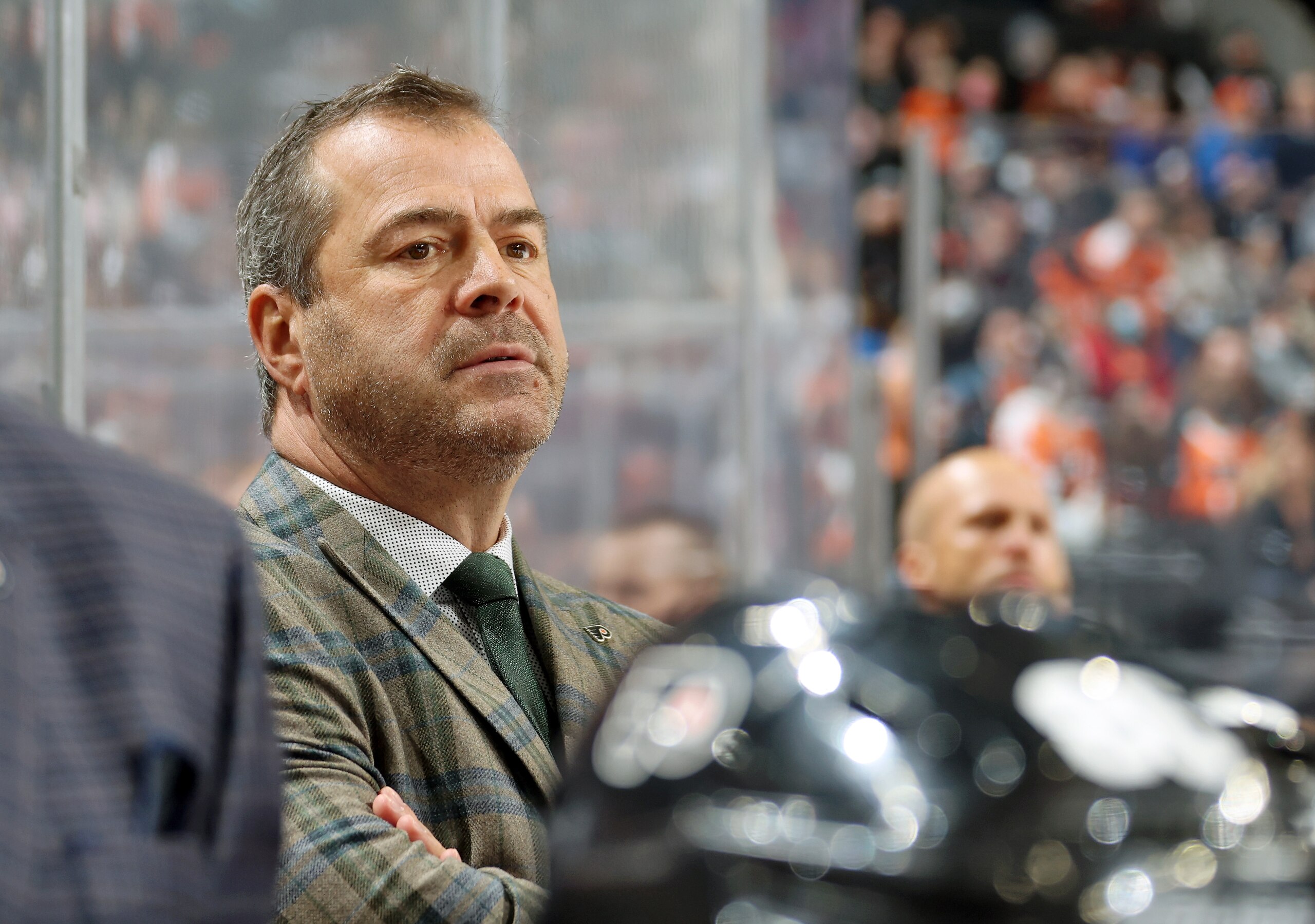 PHILADELPHIA, PA - NOVEMBER 26: Head Coach Alain Vigneault of the Philadelphia Flyers looks on from the bench during the first period against the Carolina Hurricanes at the Wells Fargo Center on November 26, 2021 in Philadelphia, Pennsylvania. (Photo by Len Redkoles/NHLI via Getty Images) PHILADELPHIA, PA - NOVEMBER 26: Head Coach Alain Vigneault of the Philadelphia Flyers looks on from the bench during the first period against the Carolina Hurricanes at the Wells Fargo Center on November 26, 2021 in Philadelphia, Pennsylvania. (Photo by Len Redkoles/NHLI via Getty Images)