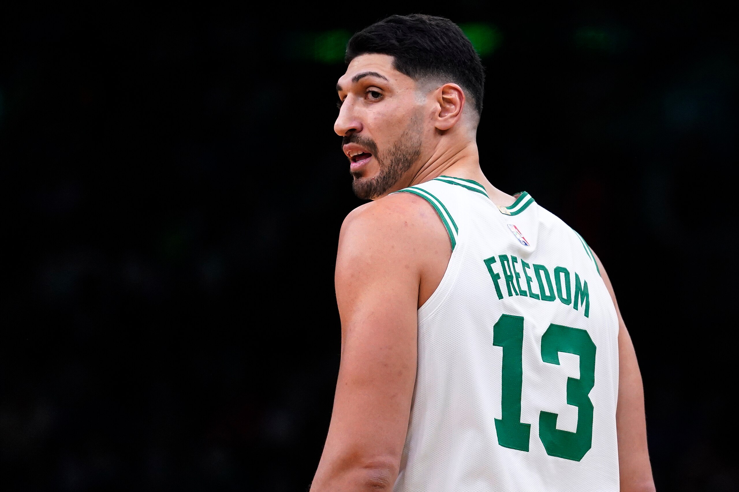 Boston Celtics center Enes Kanter Freedom looks toward the team's bench during the first half of an NBA basketball game Wednesday, Dec. 1, 2021, in Boston. The Boston Celtics center changed his name from Enes Kanter to Enes Kanter Freedom in celebration of him officially becoming a United States citizen Monday. (AP Photo/Charles Krupa)