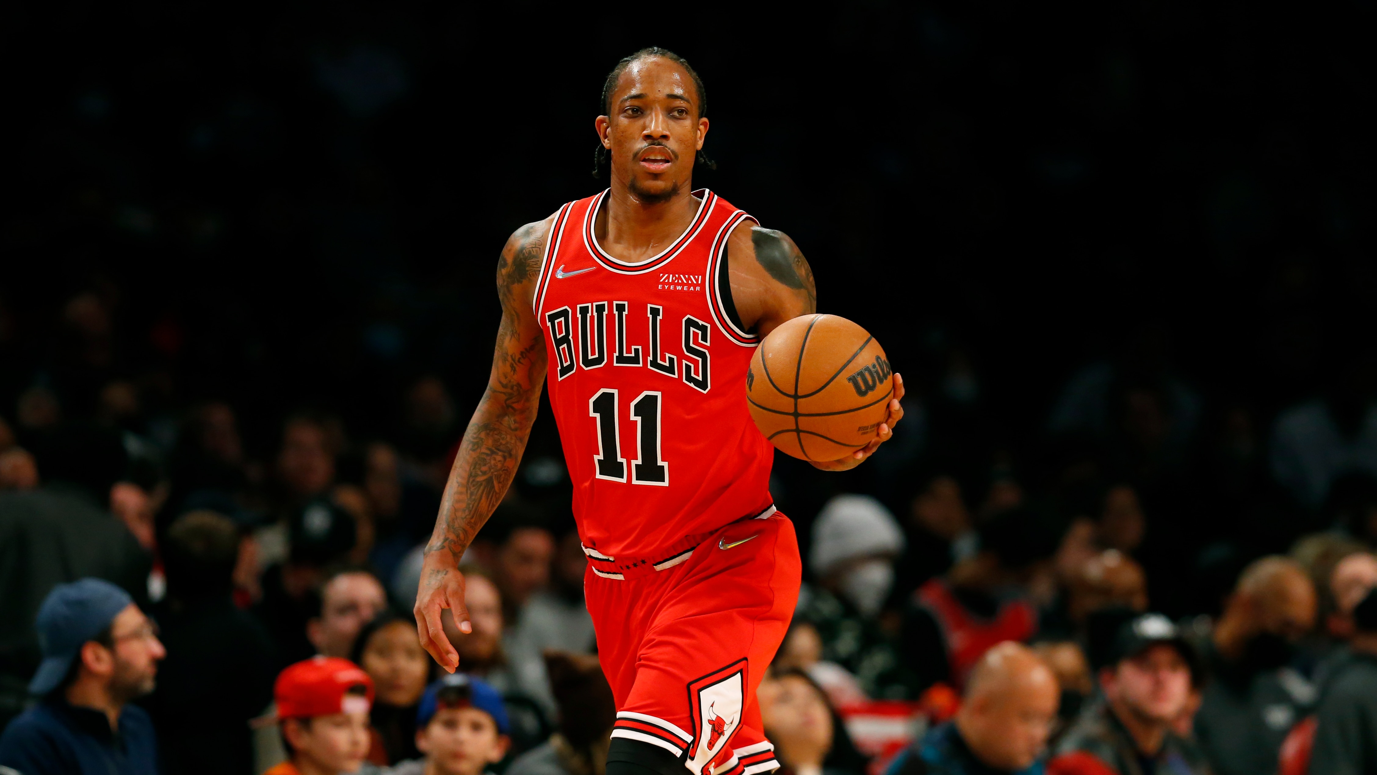Chicago Bulls forward DeMar DeRozan (11) dribbles the ball against the Brooklyn Nets during the first half of an NBA basketball game in New York, Saturday, Dec. 4, 2021. (AP Photo/Noah K. Murray)
