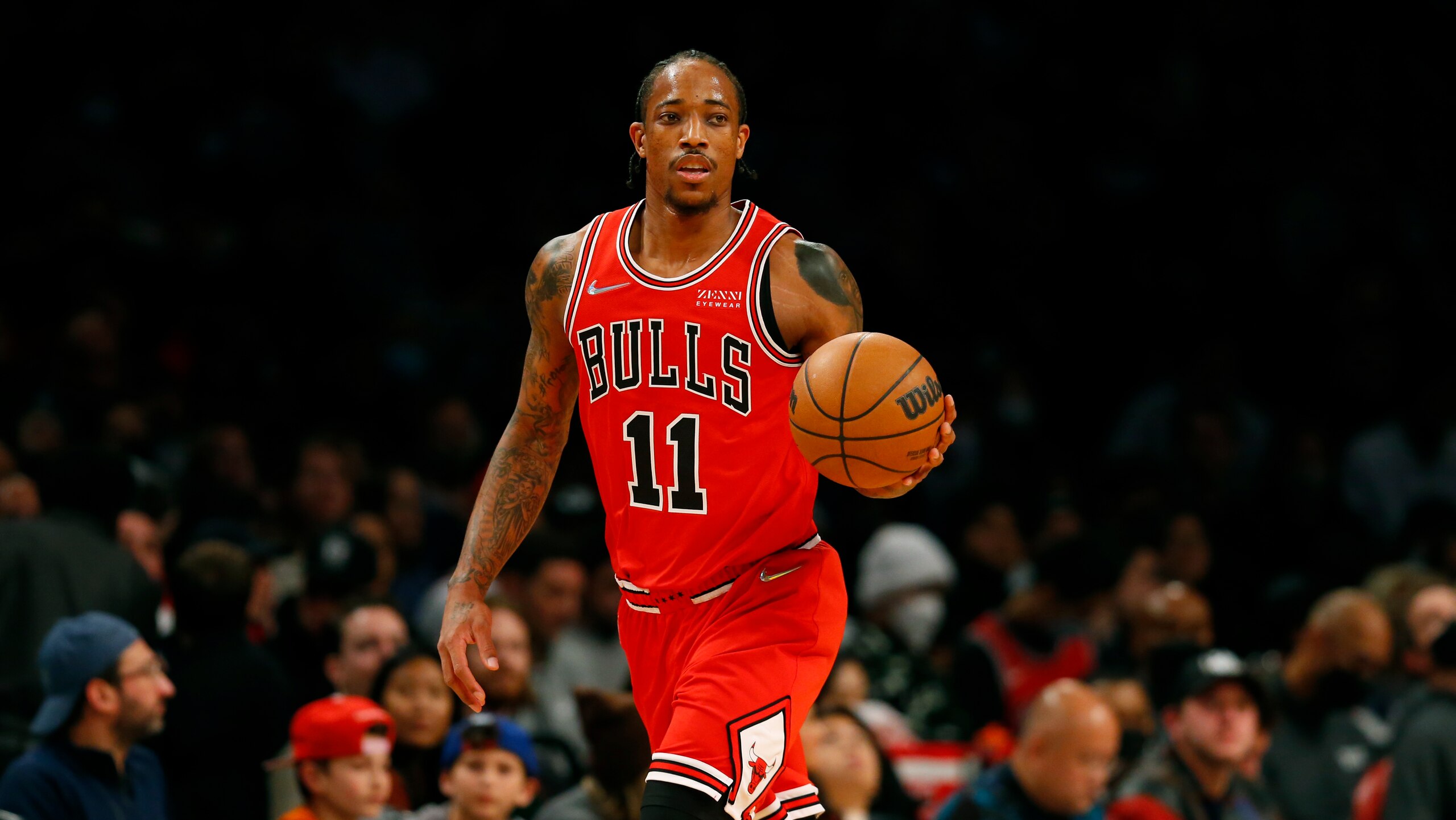Chicago Bulls forward DeMar DeRozan (11) dribbles the ball against the Brooklyn Nets during the first half of an NBA basketball game in New York, Saturday, Dec. 4, 2021. (AP Photo/Noah K. Murray)