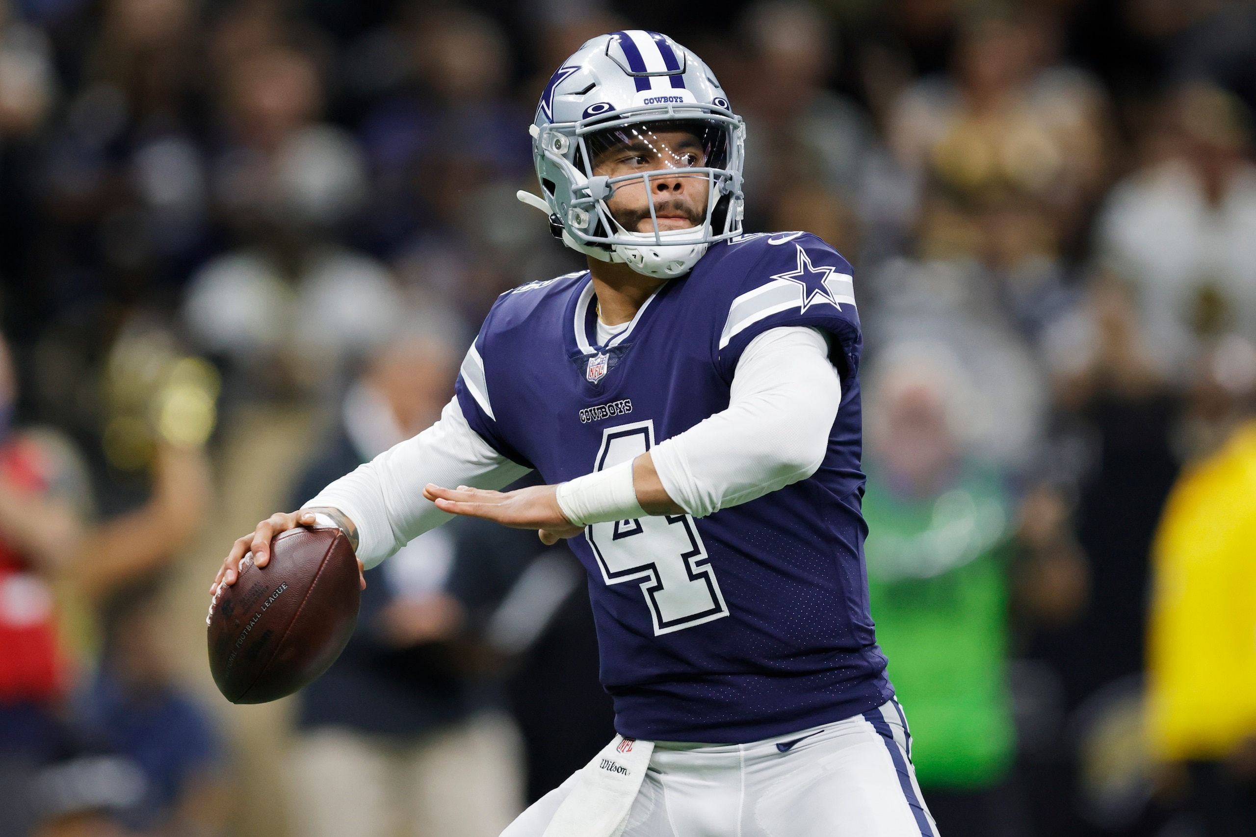 Dallas Cowboys quarterback Dak Prescott (4) passes in the pocket against the New Orleans Saints during the first half of an NFL football game, Thursday, Dec. 2, 2021, in New Orleans. (AP Photo/Brett Duke)