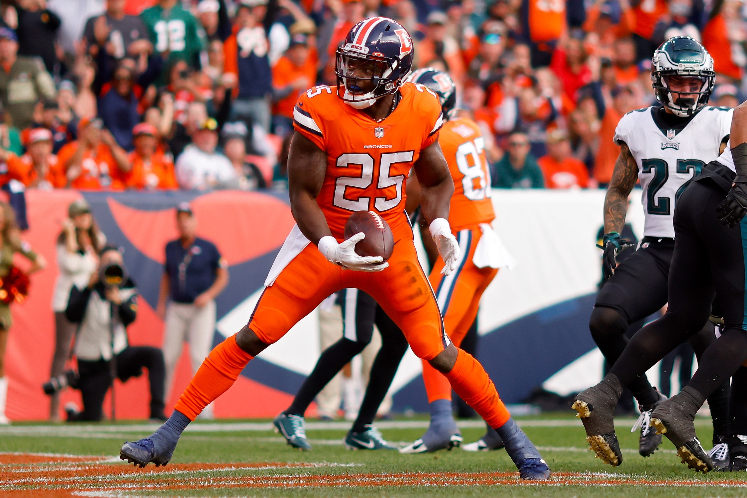 DENVER, COLORADO - NOVEMBER 14: Melvin Gordon #25 of the Denver Broncos scores a touchdown during the second quarter against the Philadelphia Eagles at Empower Field At Mile High on November 14, 2021 in Denver, Colorado. (Photo by Justin Edmonds/Getty Images)