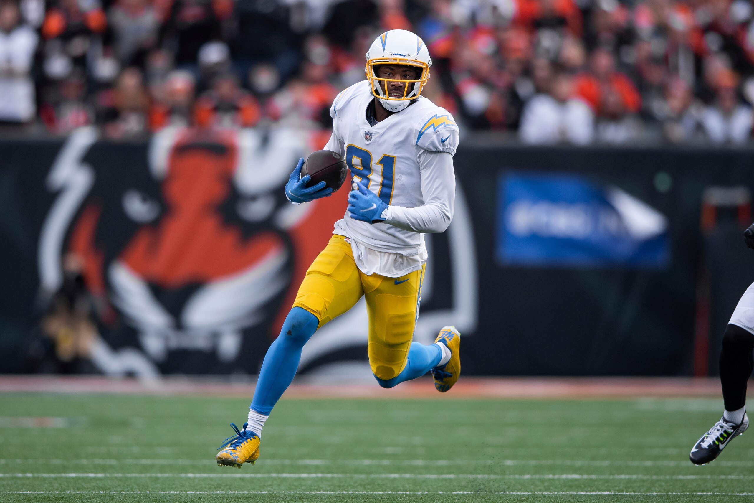 Los Angeles Chargers wide receiver Mike Williams (81) runs to the outside after a catch during an NFL football game against the Cincinnati Bengals, Sunday, Dec. 5, 2021, in Cincinnati. (AP Photo/Zach Bolinger)