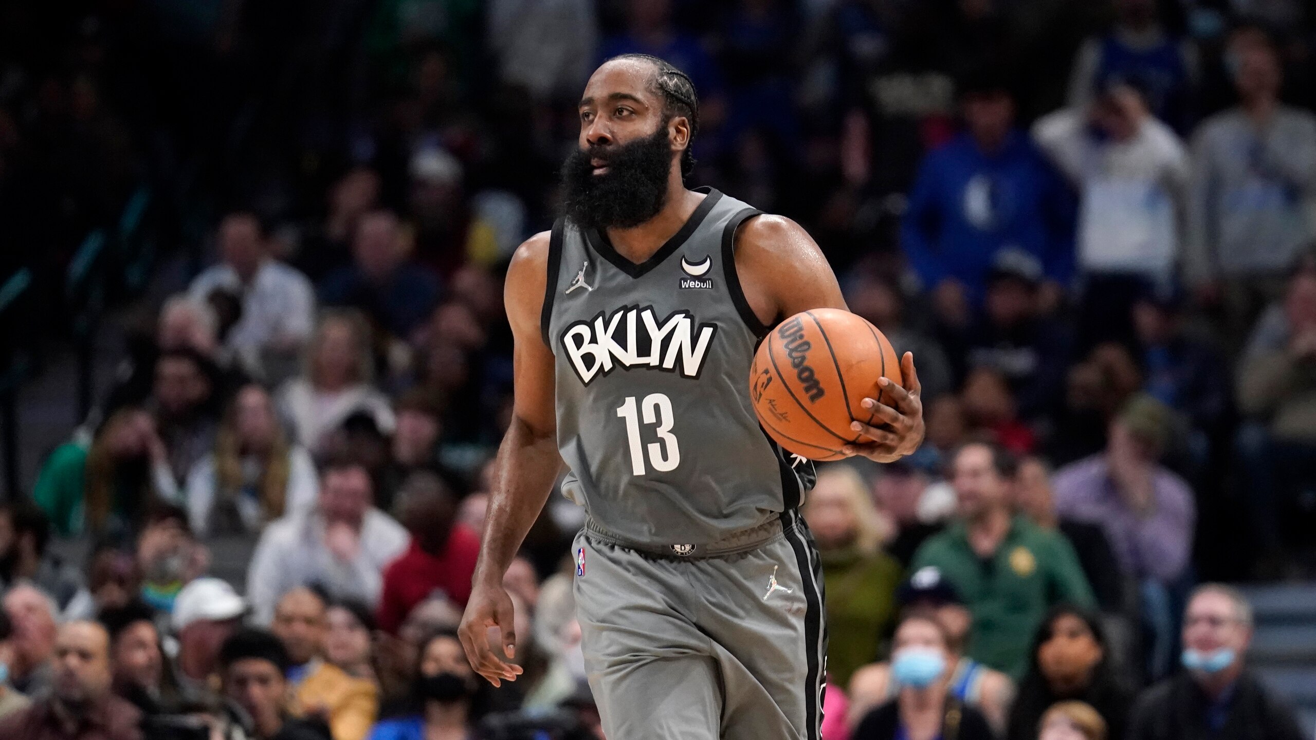 Brooklyn Nets guard James Harden advances the ball against the Dallas Mavericks during an NBA basketball game in Dallas, Tuesday, Dec. 7, 2021. (AP Photo/Tony Gutierrez)