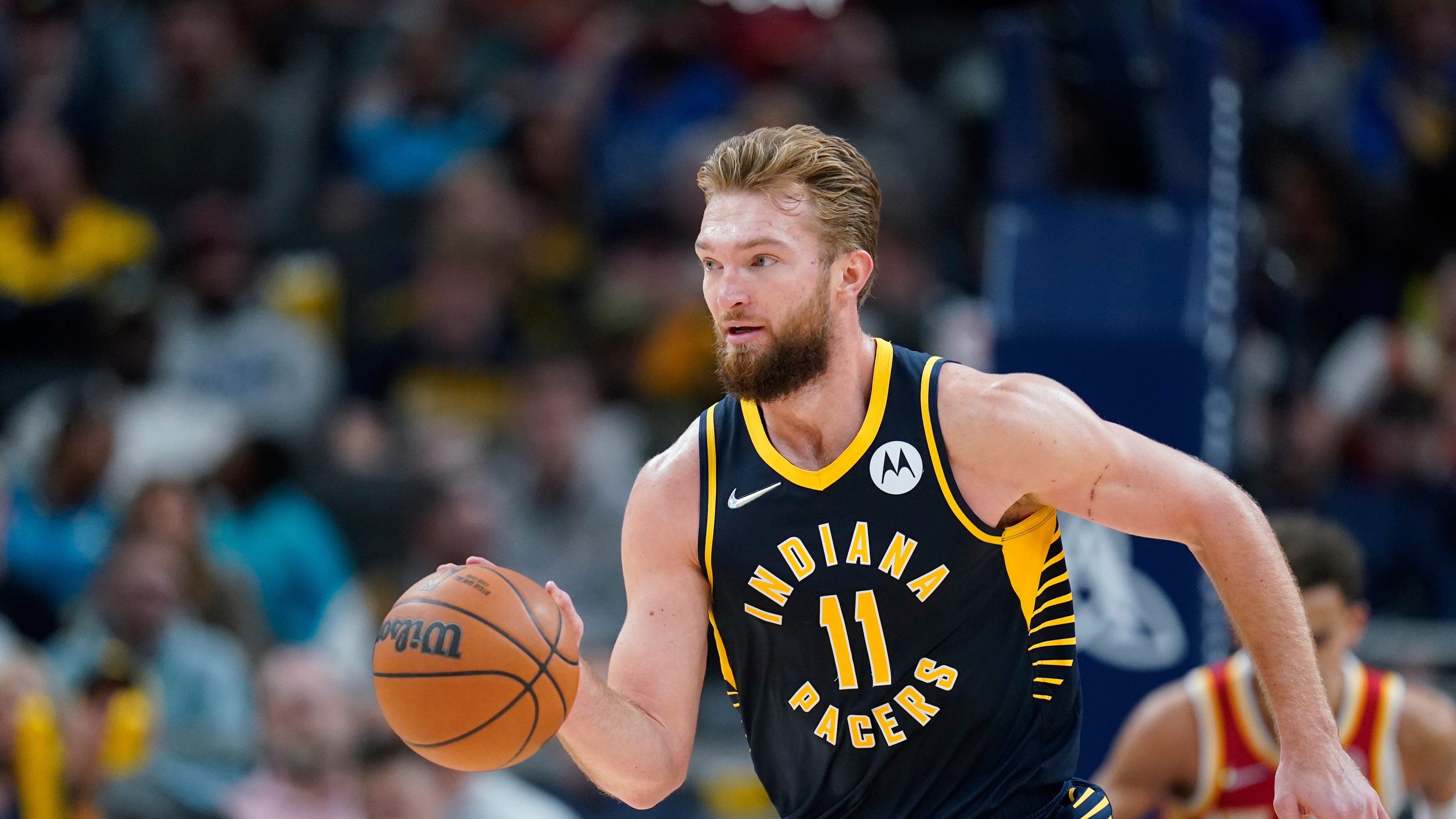 Indiana Pacers' Domantas Sabonis (11) dribbles during the second half of an NBA basketball game against the Atlanta Hawks, Wednesday, Dec. 1, 2021, in Indianapolis. (AP Photo/Darron Cummings)