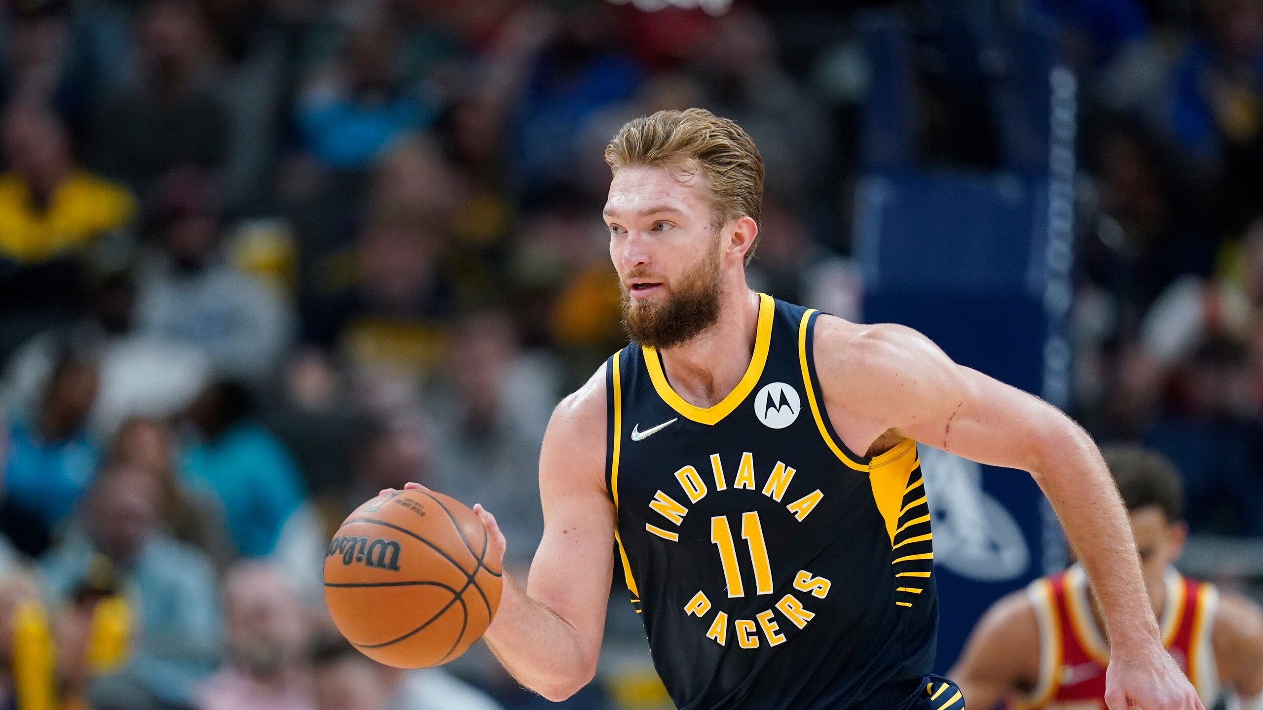 Indiana Pacers' Domantas Sabonis (11) dribbles during the second half of an NBA basketball game against the Atlanta Hawks, Wednesday, Dec. 1, 2021, in Indianapolis. (AP Photo/Darron Cummings)