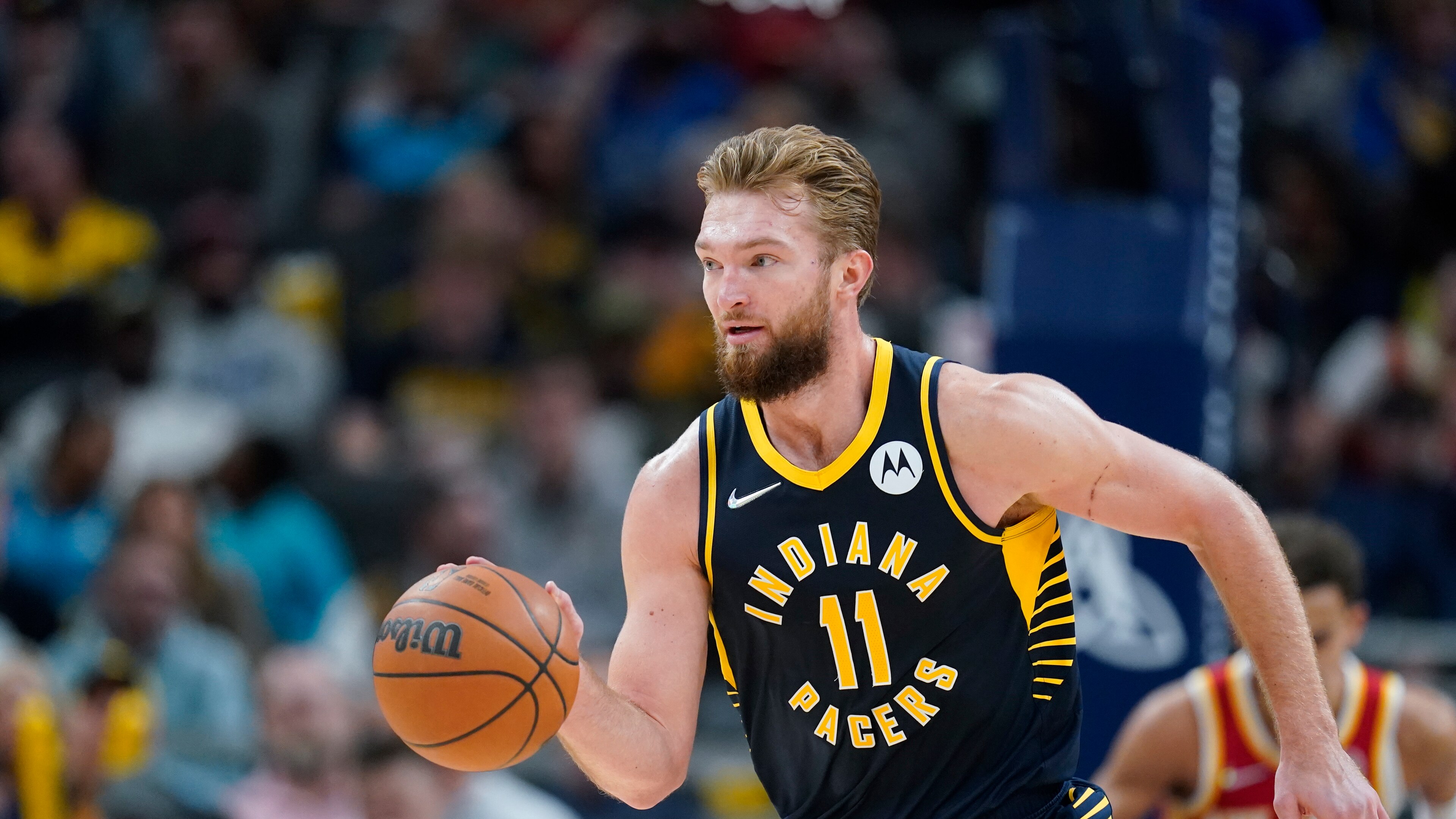 Indiana Pacers' Domantas Sabonis (11) dribbles during the second half of an NBA basketball game against the Atlanta Hawks, Wednesday, Dec. 1, 2021, in Indianapolis. (AP Photo/Darron Cummings)