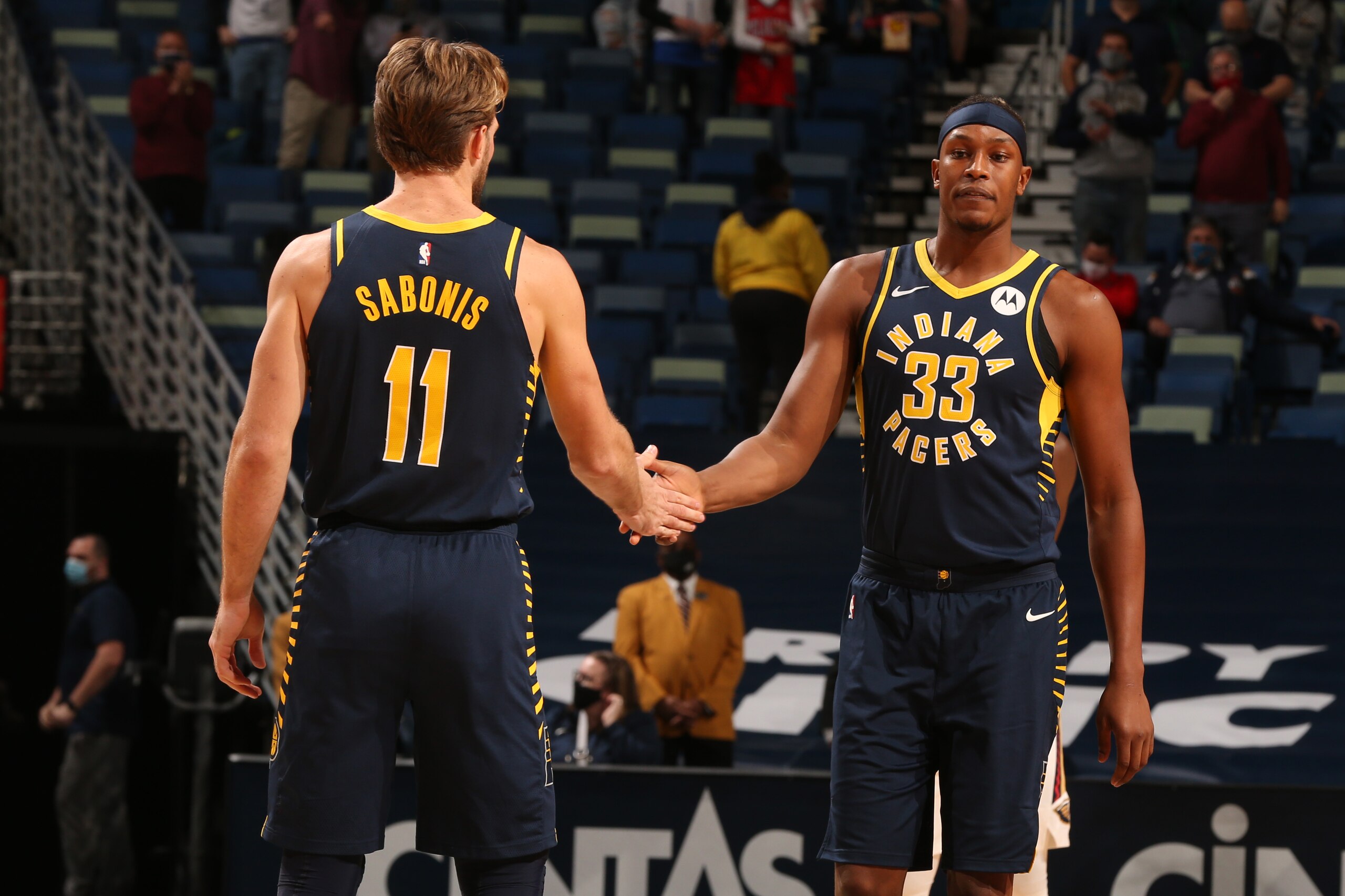 NEW ORLEANS, LA - JANUARY 4: Myles Turner #33 hi-fives Domantas Sabonis #11 of the Indiana Pacers before the game against the New Orleans Pelicans on January 4, 2021 at the Smoothie King Center in New Orleans, Louisiana. NOTE TO USER: User expressly acknowledges and agrees that, by downloading and or using this Photograph, user is consenting to the terms and conditions of the Getty Images License Agreement. Mandatory Copyright Notice: Copyright 2021 NBAE (Photo by Layne Murdoch Jr./NBAE via Getty Images)