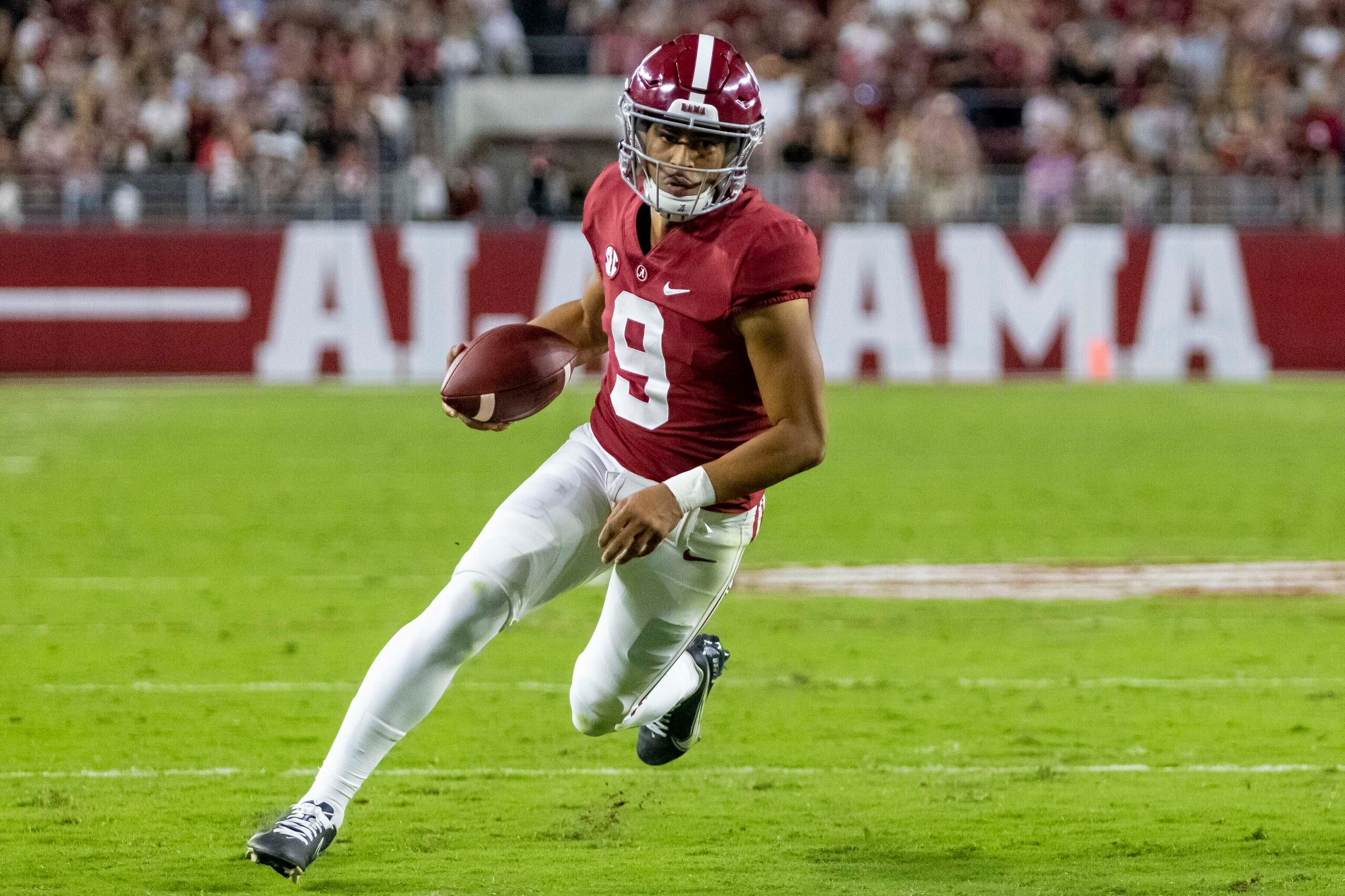 FILE - Alabama quarterback Bryce Young runs the ball against Tennessee during the first half of an NCAA college football game Saturday, Oct. 23, 2021, in Tuscaloosa, Ala. Young was selected to The Associated Press All-SEC team in results released Wednesday, Dec. 8, 2021. (AP Photo/Vasha Hunt, File)