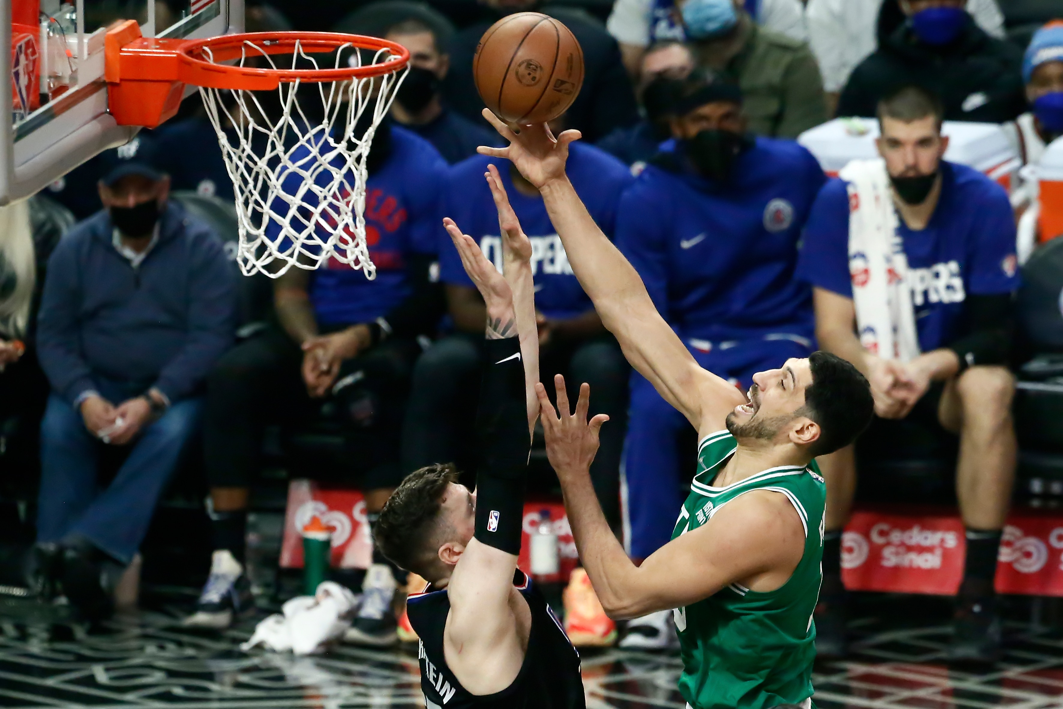 LOS ANGELES, CA - DECEMBER 8: Enes Freedom #13 of the Boston Celtics shoots the ball against Isaiah Hartenstein #55 of the LA Clippers during a game at the STAPLES Center on December 8, 2021 in Los Angeles, California. NOTE TO USER: User expressly acknowledges and agrees that, by downloading and or using this photograph, User is consenting to the terms and conditions of the Getty Images License Agreement. Mandatory Credit: 2021 NBAE (Photo by Chris Elise/NBAE via Getty Images)