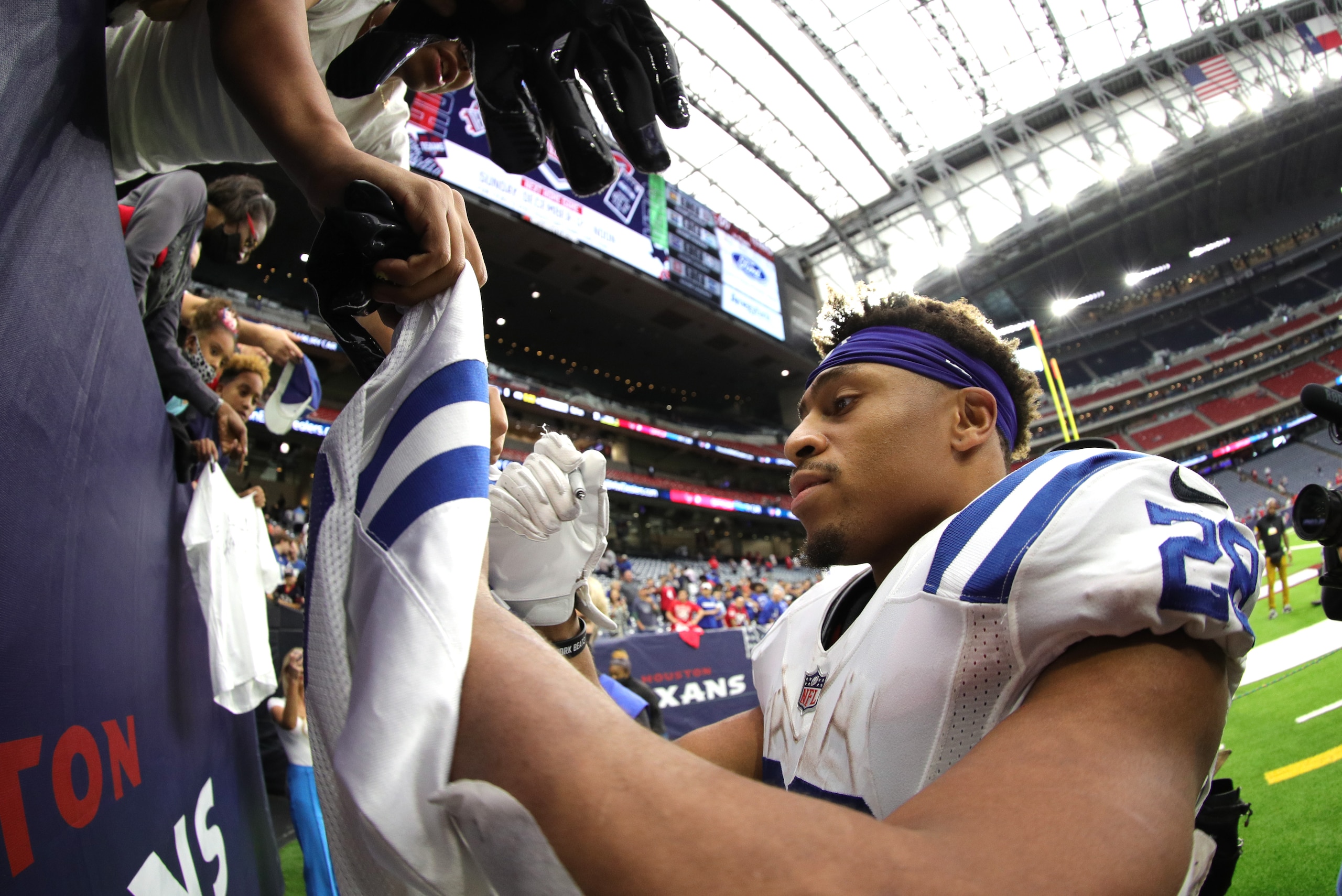 HOUSTON, TEXAS - DECEMBER 05: Jonathan Taylor #28 of the Indianapolis Colts signs autographs after the game \ahou at NRG Stadium on December 05, 2021 in Houston, Texas. (Photo by Carmen Mandato/Getty Images)
