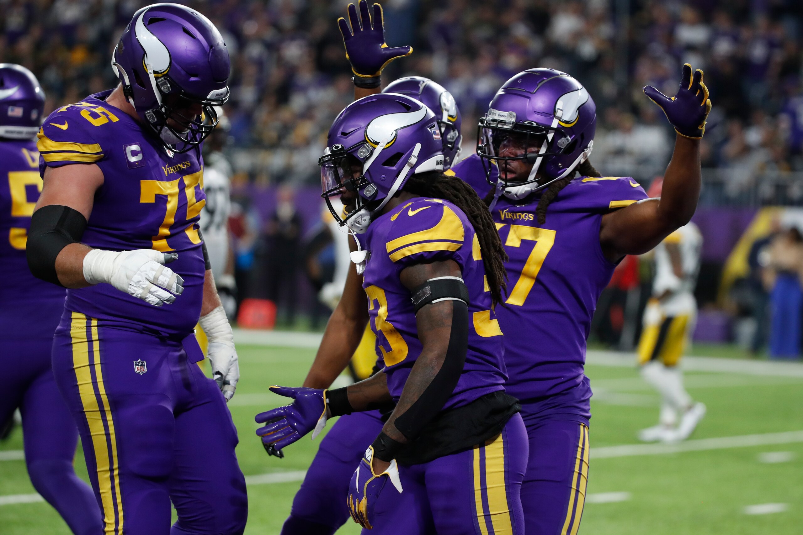 Minnesota Vikings running back Dalvin Cook celebrates with teammates after scoring on a 7-yard touchdown run during the first half of an NFL football game against the Pittsburgh Steelers, Thursday, Dec. 9, 2021, in Minneapolis. (AP Photo/Bruce Kluckhohn)