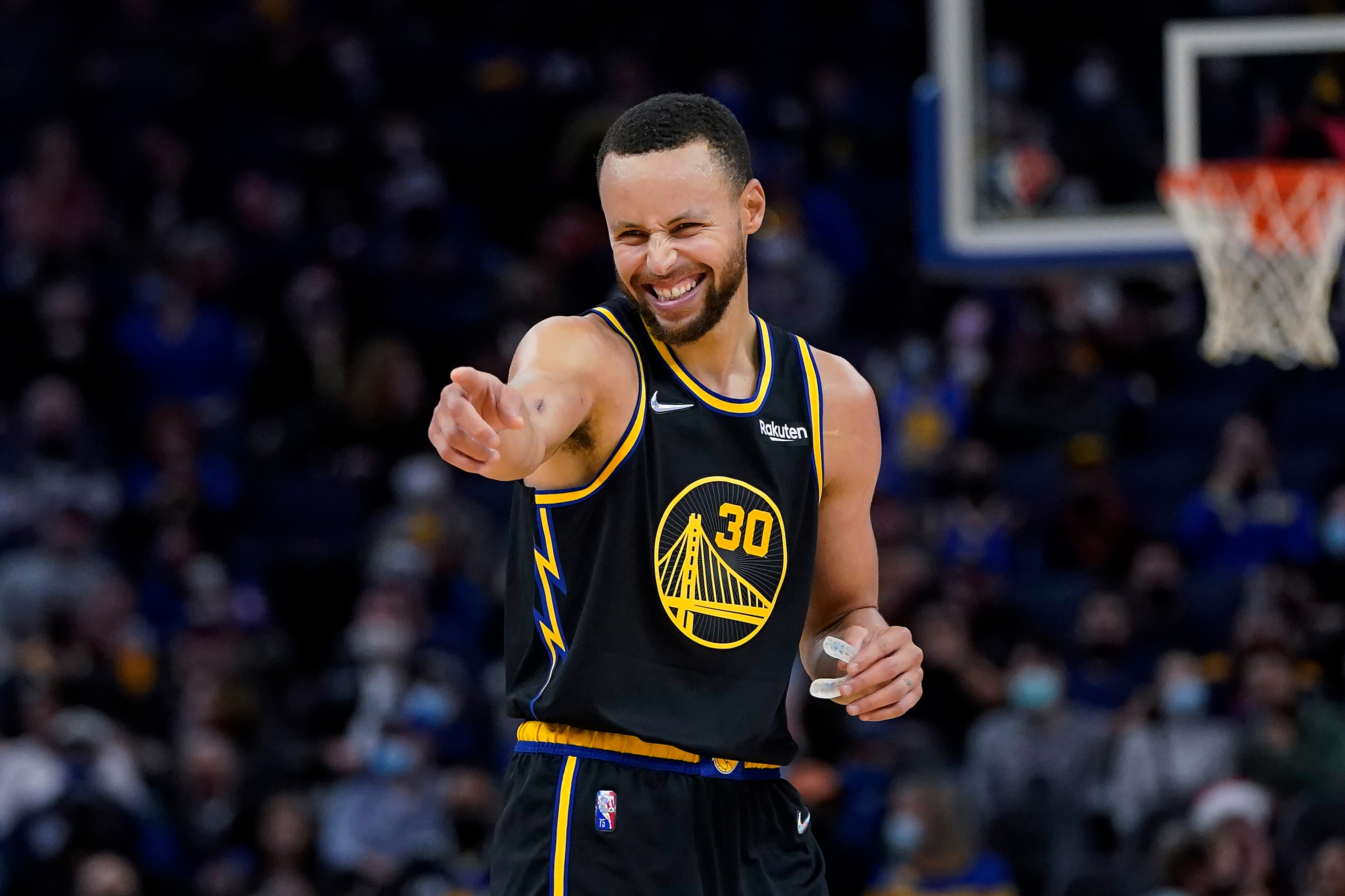 Golden State Warriors guard Stephen Curry celebrates during the second half of the team's NBA basketball game against the Portland Trail Blazers in San Francisco, Wednesday, Dec. 8, 2021. (AP Photo/Jeff Chiu) Golden State Warriors guard Stephen Curry celebrates during the second half of the team's NBA basketball game against the Portland Trail Blazers in San Francisco, Wednesday, Dec. 8, 2021. (AP Photo/Jeff Chiu)