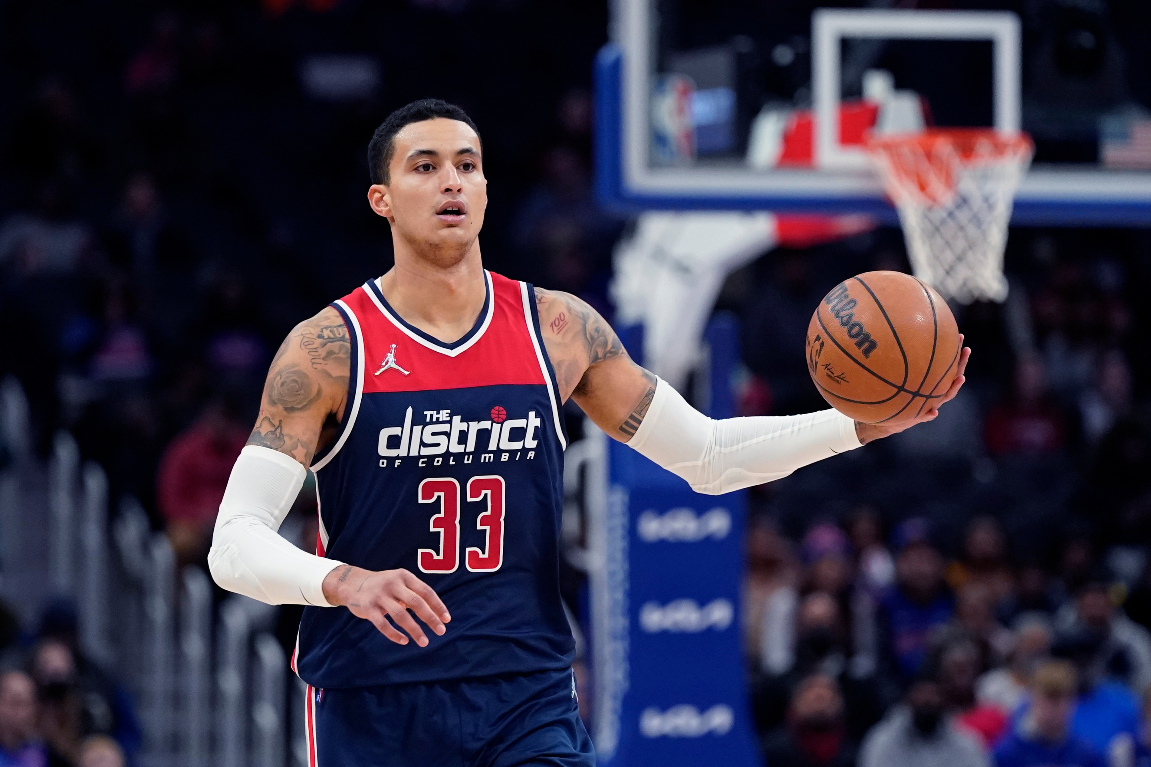 Washington Wizards forward Kyle Kuzma brings the ball up court during the first half of an NBA basketball game against the Detroit Pistons, Wednesday, Dec. 8, 2021, in Detroit. (AP Photo/Carlos Osorio)