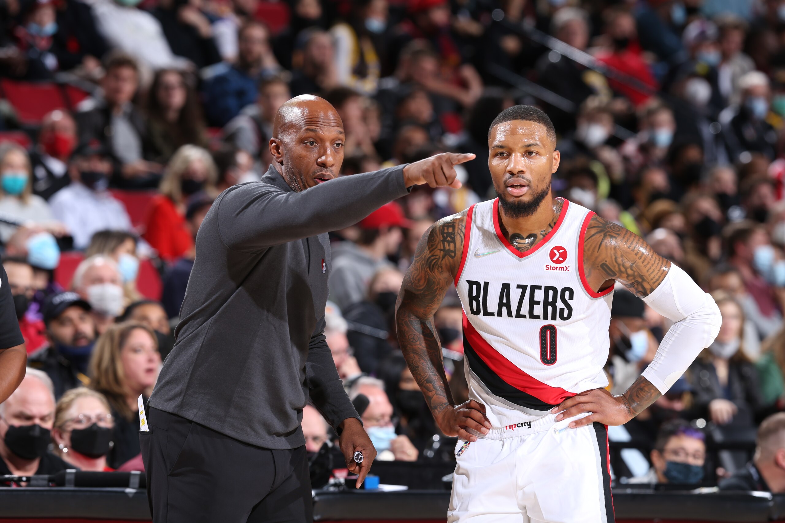 PORTLAND, OR - NOVEMBER 6: Head Coach, Chauncey Billups talks with Damian Lillard #0 of the Portland Trail Blazers during the game against the Los Angeles Lakers on November 6, 2021 at the Moda Center Arena in Portland, Oregon. NOTE TO USER: User expressly acknowledges and agrees that, by downloading and or using this photograph, user is consenting to the terms and conditions of the Getty Images License Agreement. Mandatory Copyright Notice: Copyright 2021 NBAE (Photo by Sam Forencich/NBAE via Getty Images)