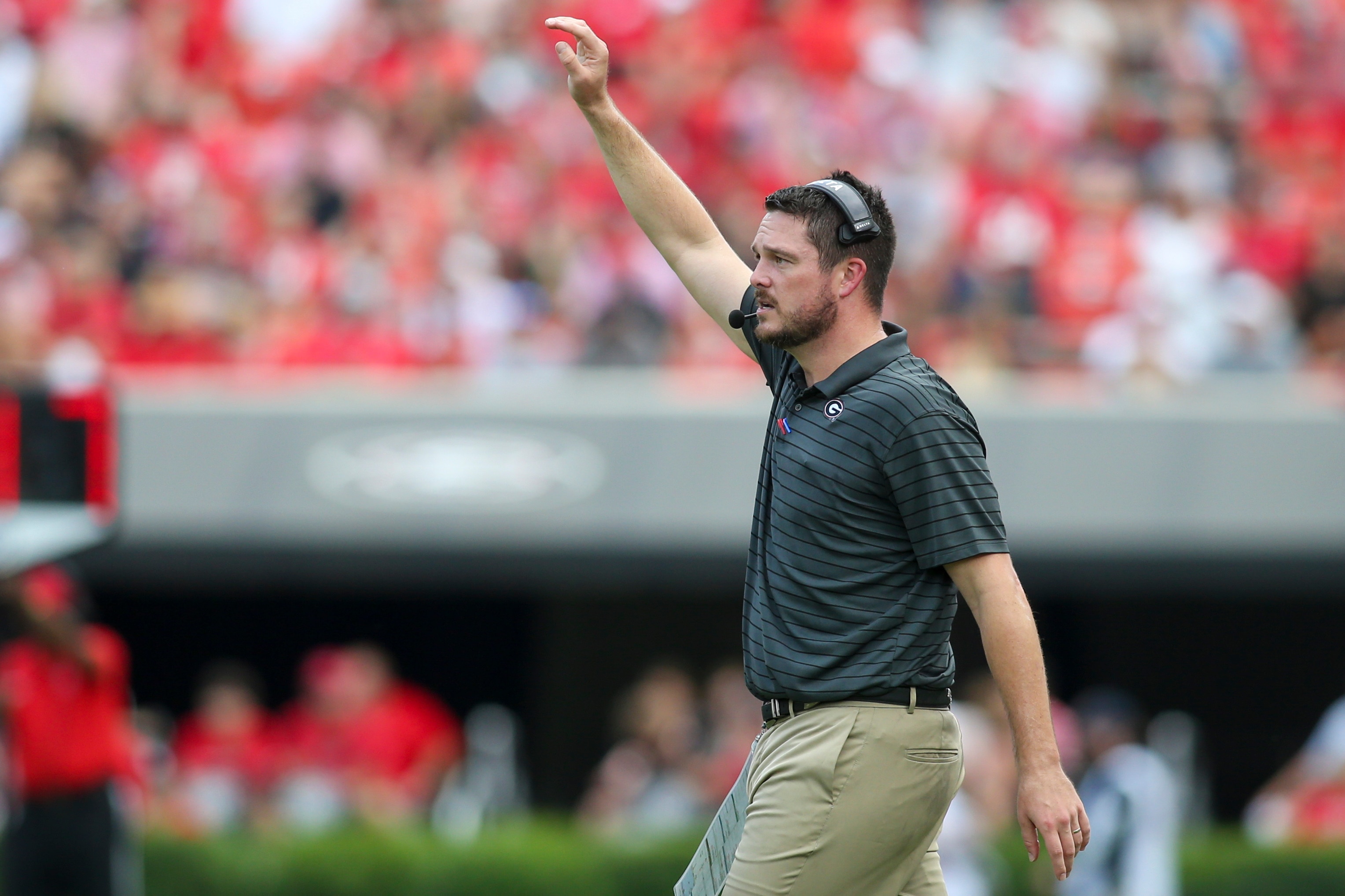 ATHENS, GA - SEPTEMBER 11: Defensive coordinator Dan Lanning of the Georgia Bulldogs calls a play against the UAB Blazers in the first half at Sanford Stadium on September 11, 2021 in Athens, Georgia. (Photo by Brett Davis/Getty Images)