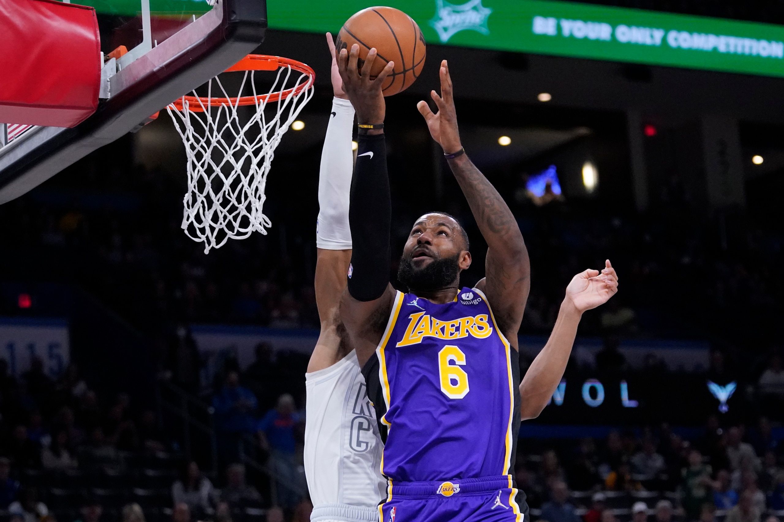 Los Angeles Lakers forward LeBron James (6) goes to the basket in front of Oklahoma City Thunder forward Darius Bazley during the first half of an NBA basketball game Friday, Dec. 10, 2021, in Oklahoma City. (AP Photo/Sue Ogrocki) Los Angeles Lakers forward LeBron James (6) goes to the basket in front of Oklahoma City Thunder forward Darius Bazley during the first half of an NBA basketball game Friday, Dec. 10, 2021, in Oklahoma City. (AP Photo/Sue Ogrocki)