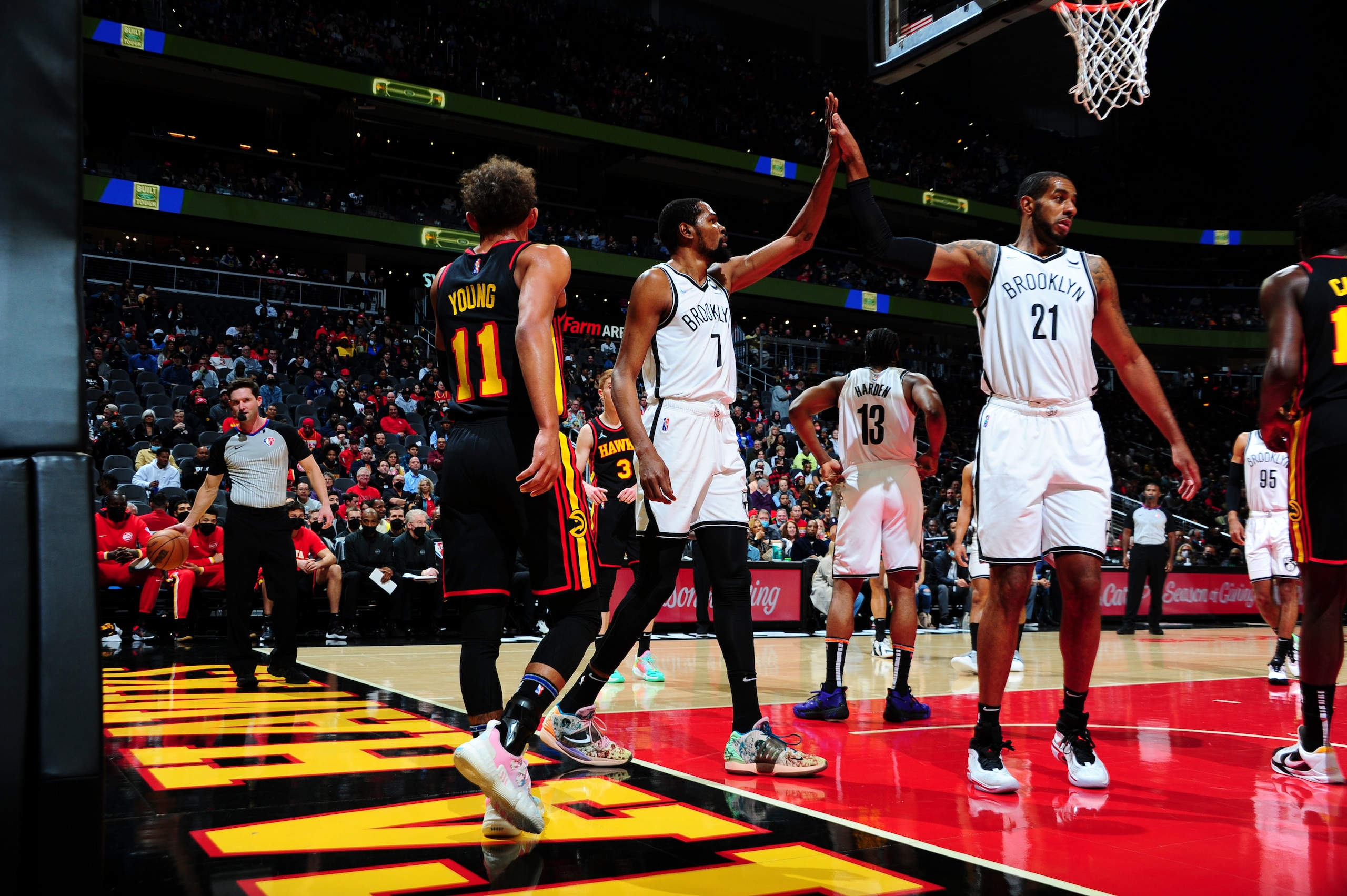 ATLANTA, GA - DECEMBER 10: Kevin Durant #7 of the Brooklyn Nets high fives LaMarcus Aldridge #21 of the Brooklyn Nets during the game against the Atlanta Hawks on December 10, 2021 at State Farm Arena in Atlanta, Georgia.  NOTE TO USER: User expressly acknowledges and agrees that, by downloading and/or using this Photograph, user is consenting to the terms and conditions of the Getty Images License Agreement. Mandatory Copyright Notice: Copyright 2021 NBAE (Photo by Scott Cunningham/NBAE via Getty Images)