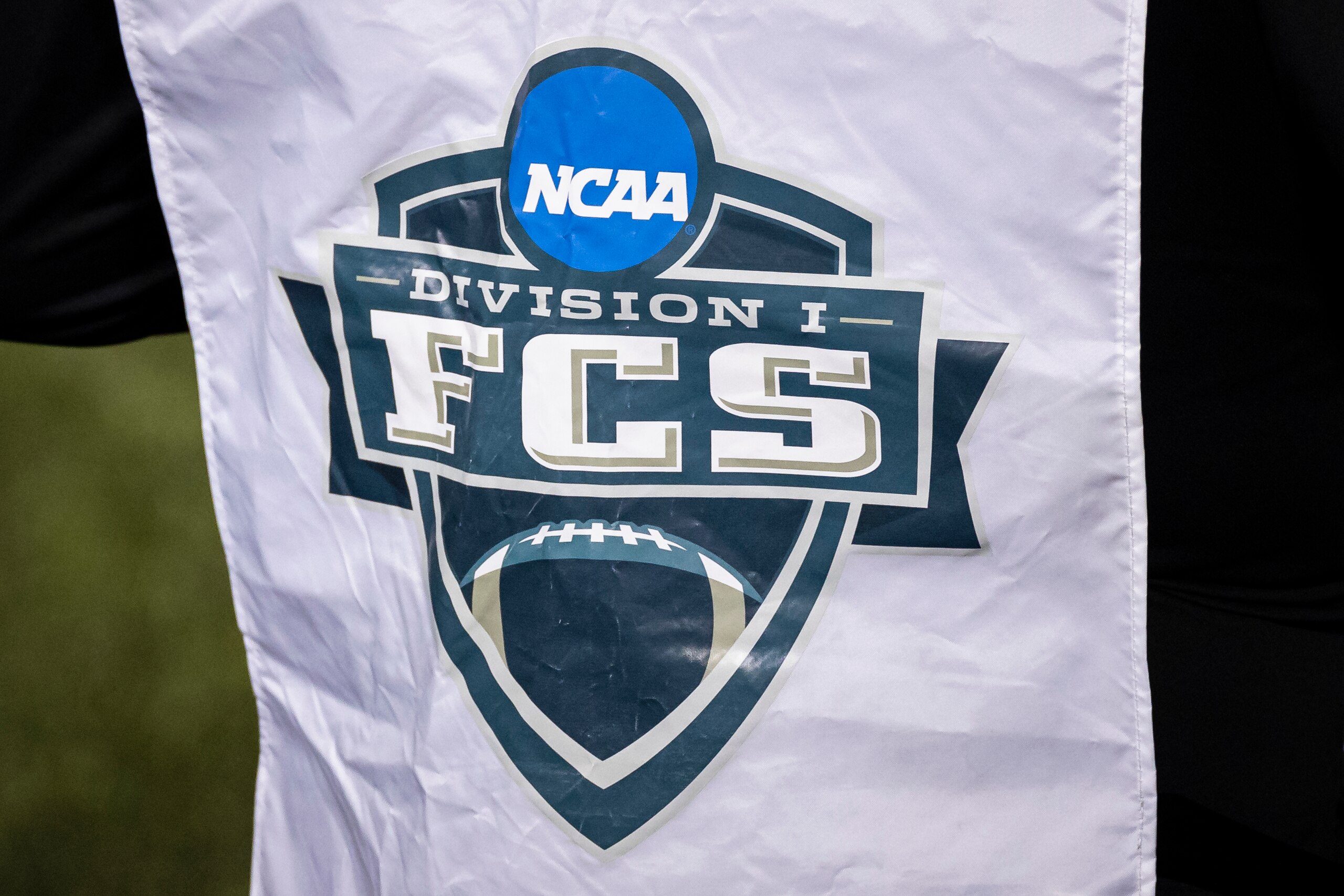 HARRISONBURG, VA - May 02: A view of the NCAA FCS logo on the sidelines during the second half of the NCAA Division I FCS Football Championship Quarterfinal game between the James Madison Dukes and the North Dakota Fighting Hawks at Bridgeforth Stadium on May 2, 2021 in Harrisonburg, Virginia. (Photo by Scott Taetsch/Getty Images) HARRISONBURG, VA - May 02: A view of the NCAA FCS logo on the sidelines during the second half of the NCAA Division I FCS Football Championship Quarterfinal game between the James Madison Dukes and the North Dakota Fighting Hawks at Bridgeforth Stadium on May 2, 2021 in Harrisonburg, Virginia. (Photo by Scott Taetsch/Getty Images)