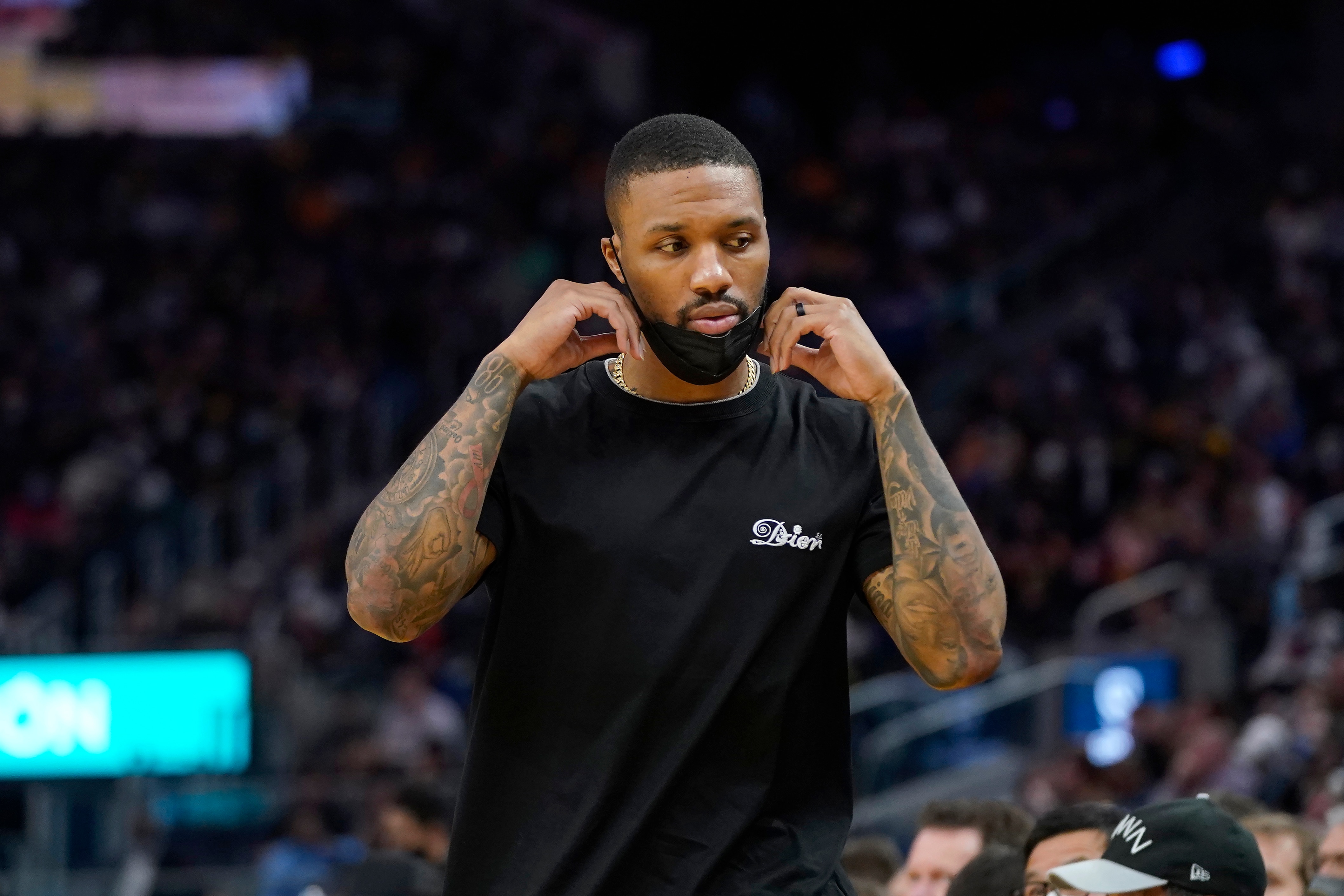 Injured Portland Trail Blazers guard Damian Lillard during an NBA basketball game against the Golden State Warriors in San Francisco, Wednesday, Dec. 8, 2021. (AP Photo/Jeff Chiu)