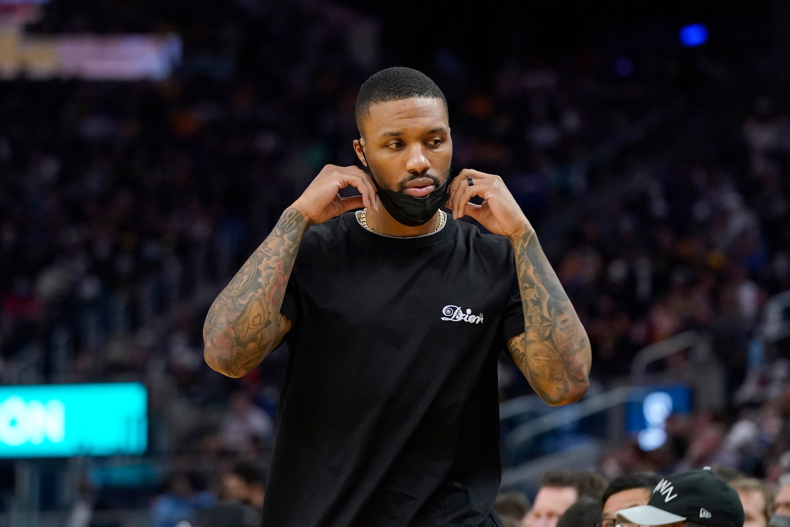 Injured Portland Trail Blazers guard Damian Lillard during an NBA basketball game against the Golden State Warriors in San Francisco, Wednesday, Dec. 8, 2021. (AP Photo/Jeff Chiu)