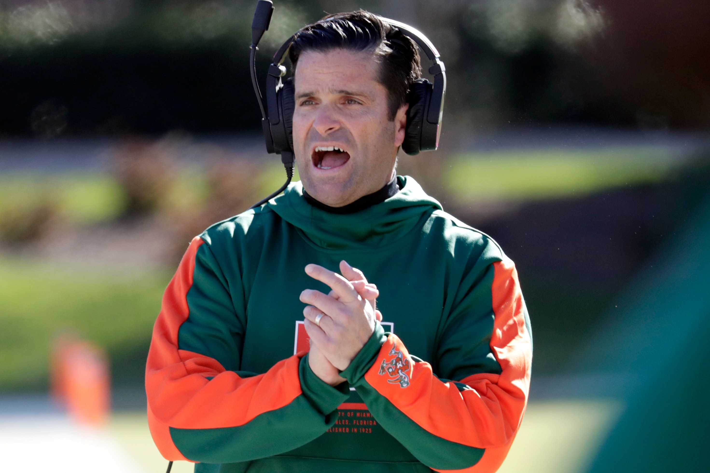Miami head coach Manny Diaz encourages his team during the first half of an NCAA college football game against Duke, Saturday, Nov. 27, 2021, in Durham, N.C. (AP Photo/Chris Seward)