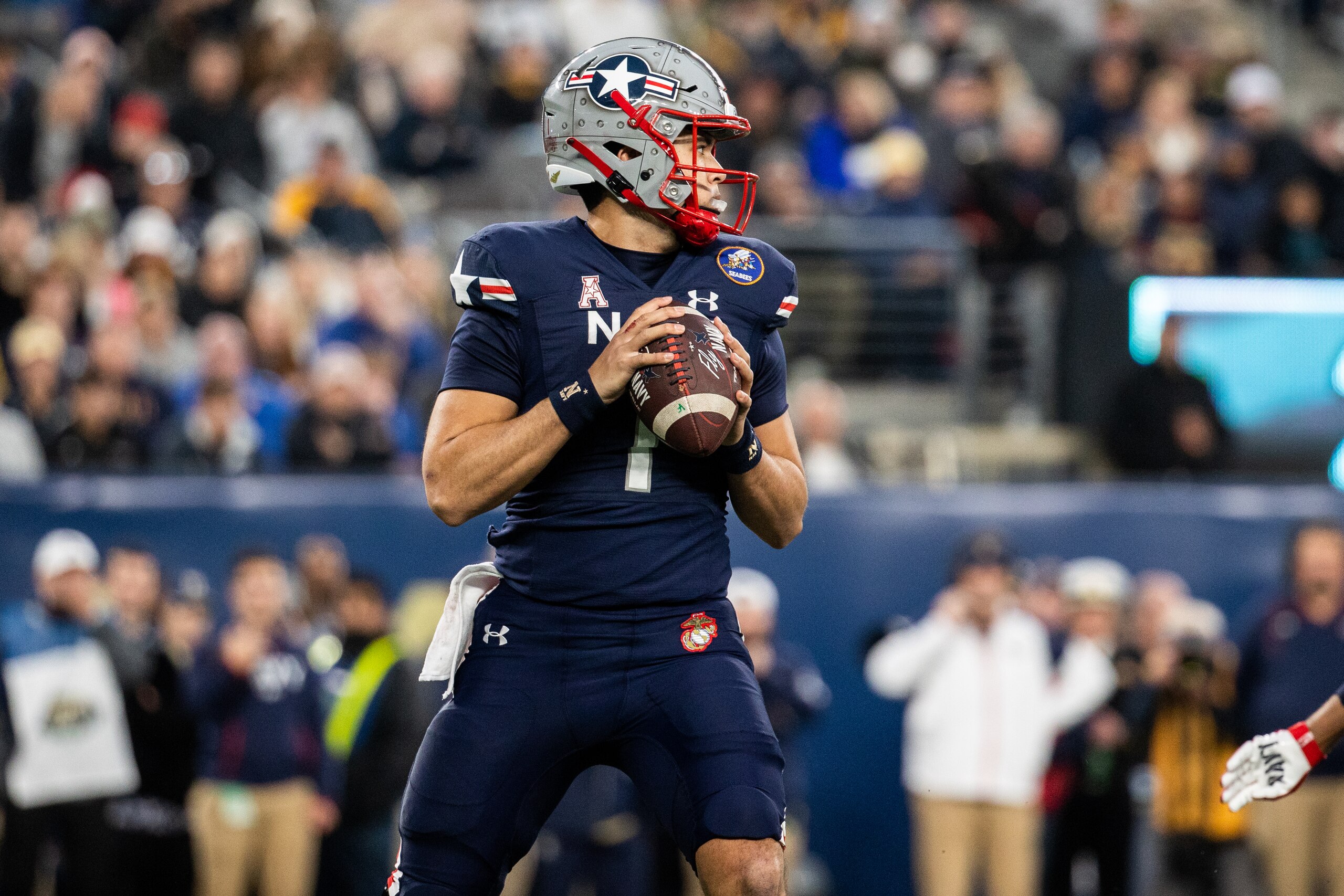EAST RUTHERFORD, NJ - DECEMBER 11: Tai Lavatai #1 of The Navy Midshipmen drops back to pass during the first half of a game against the Army Black Knights at MetLife Stadium on December 11, 2021 in East Rutherford, New Jersey. (Photo by Dustin Satloff/Getty Images)
