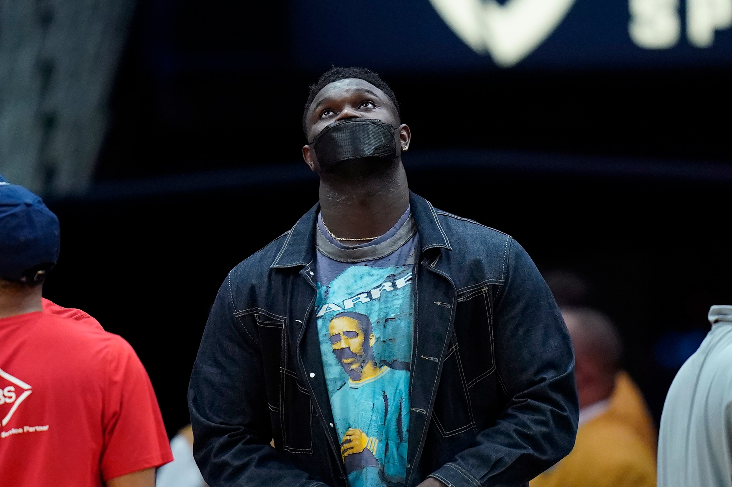 New Orleans Pelicans forward Zion Williamson looks up at the scoreboard in the first half of an NBA basketball game against the Washington Wizards in New Orleans, Wednesday, Nov. 24, 2021. (AP Photo/Gerald Herbert)