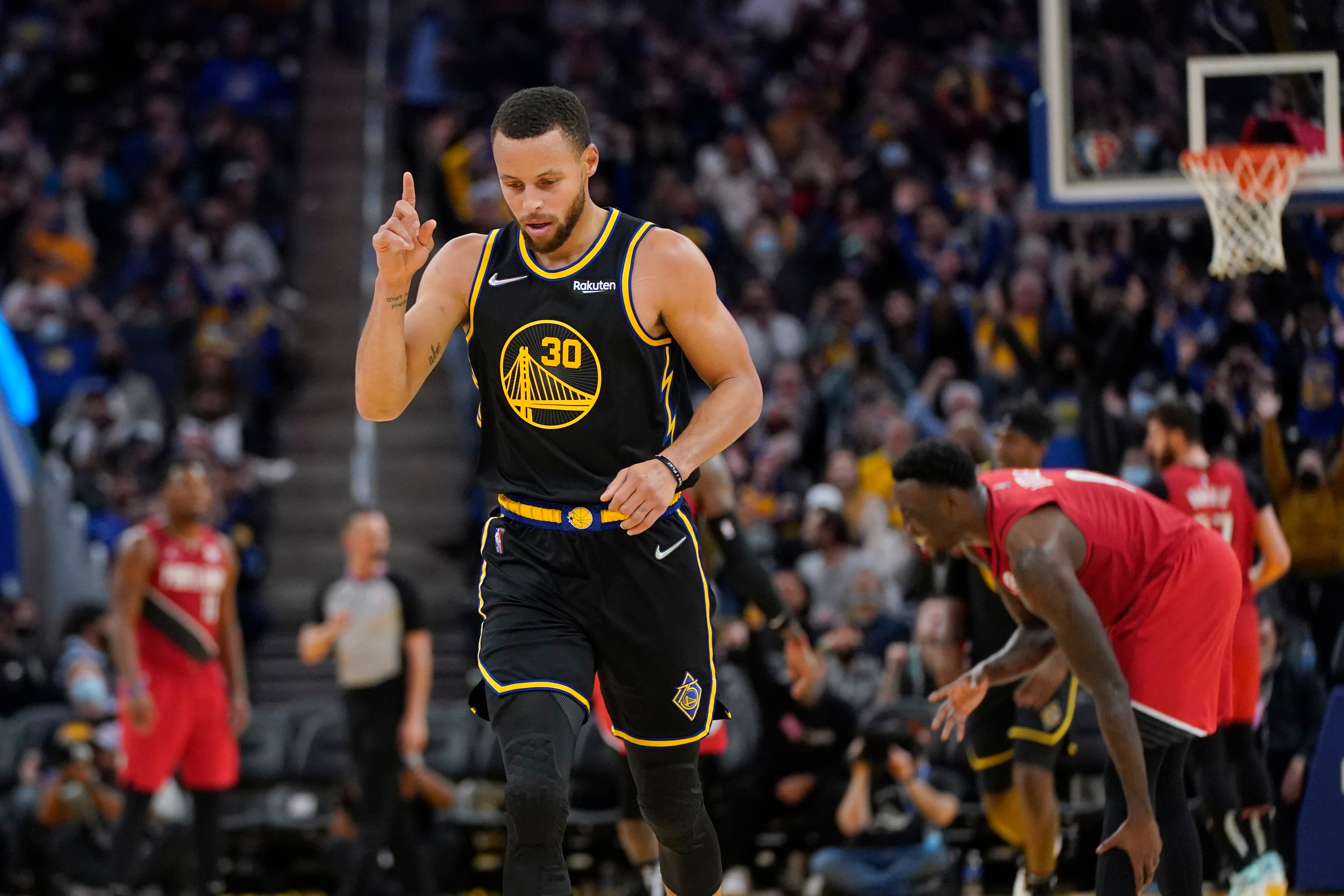 Golden State Warriors guard Stephen Curry (30) reacts after shooting against the Portland Trail Blazers during an NBA basketball game in San Francisco, Wednesday, Dec. 8, 2021. (AP Photo/Jeff Chiu) Golden State Warriors guard Stephen Curry (30) reacts after shooting against the Portland Trail Blazers during an NBA basketball game in San Francisco, Wednesday, Dec. 8, 2021. (AP Photo/Jeff Chiu)