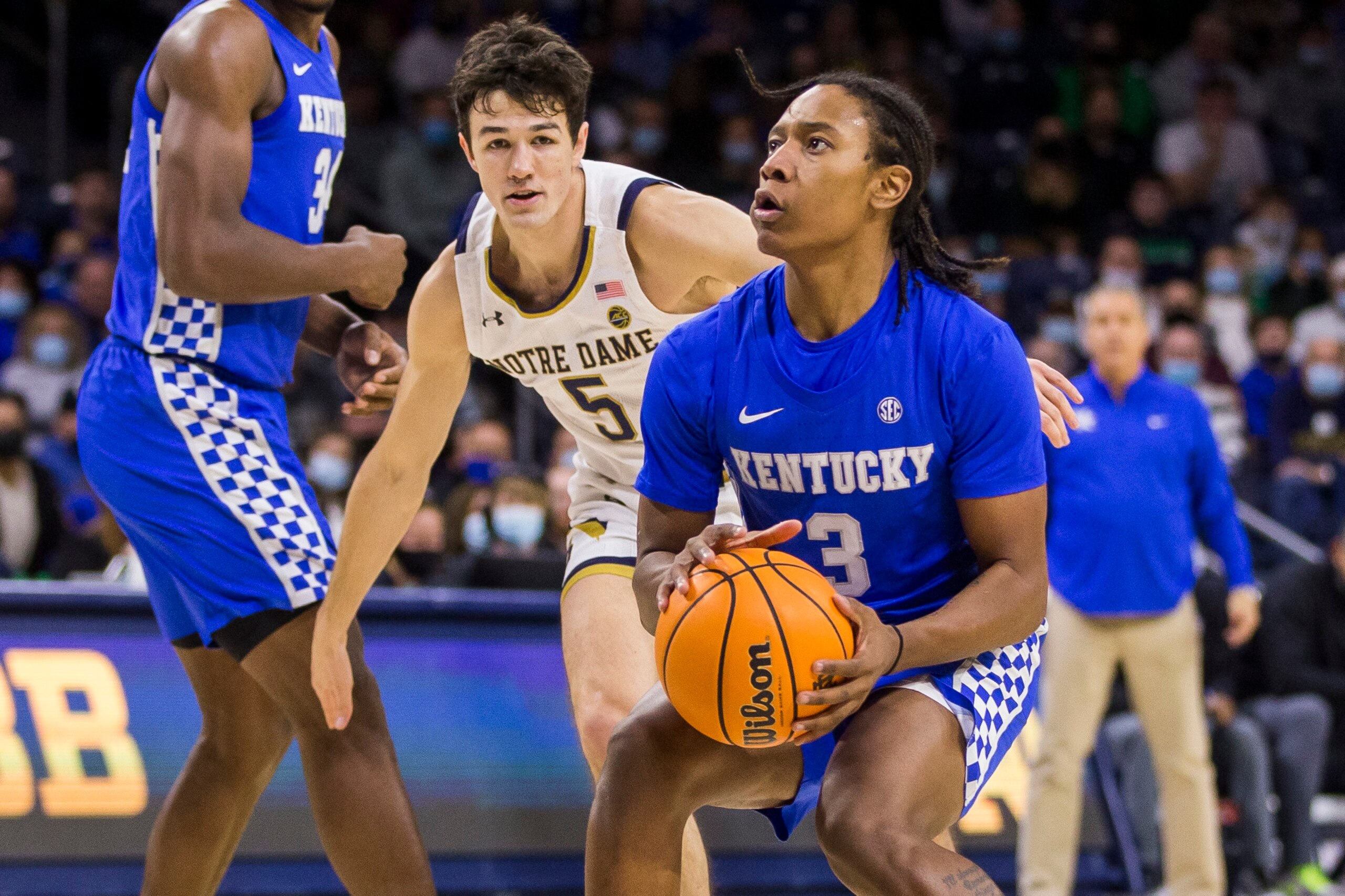 Kentucky's TyTy Washington Jr. (3) sets up for a shot in front of Notre Dame's Cormac Ryan (5) during the first half of an NCAA college basketball game Saturday, Dec. 11, 2021, in South Bend, Ind. (AP Photo/Robert Franklin)