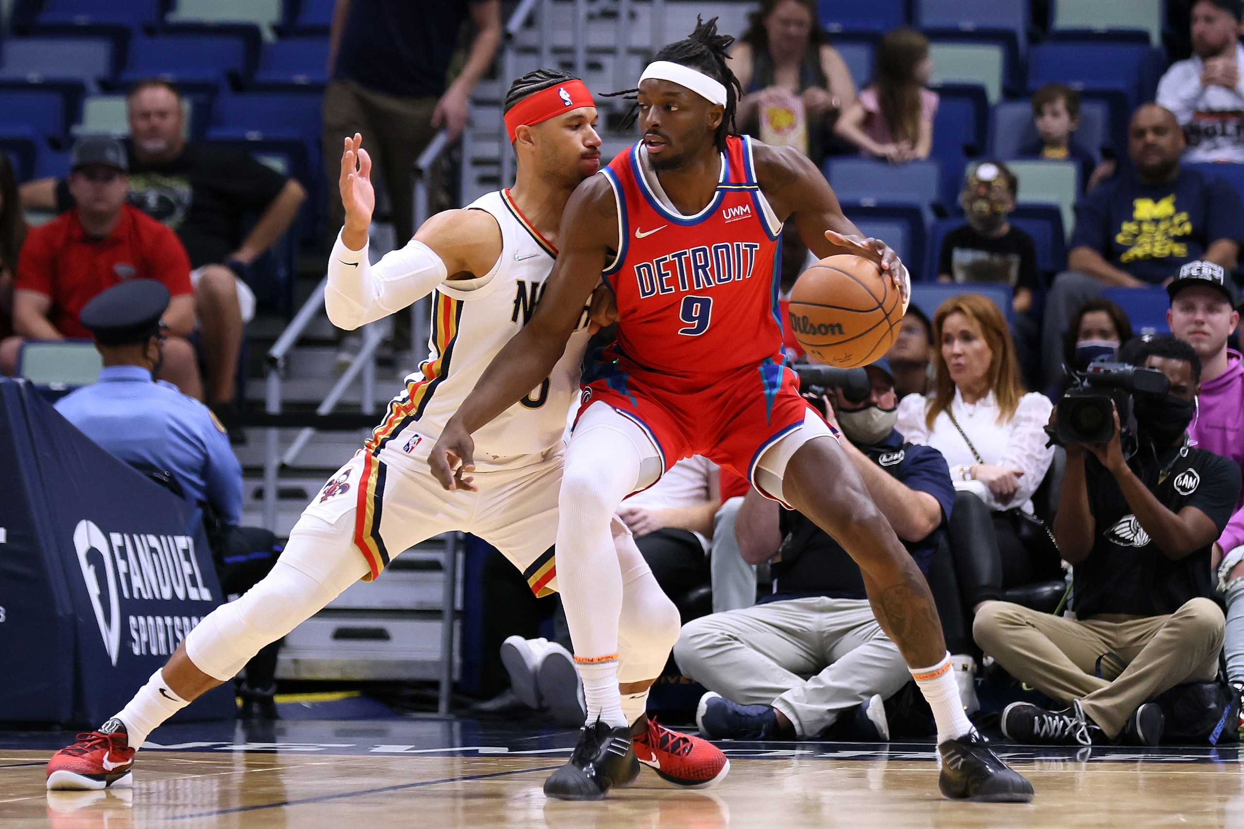 NEW ORLEANS, LOUISIANA - DECEMBER 10: Jerami Grant #9 of the Detroit Pistons drives against Josh Hart #3 of the New Orleans Pelicans during the first half at the Smoothie King Center on December 10, 2021 in New Orleans, Louisiana. NOTE TO USER: User expressly acknowledges and agrees that, by downloading and or using this Photograph, user is consenting to the terms and conditions of the Getty Images License Agreement. (Photo by Jonathan Bachman/Getty Images)