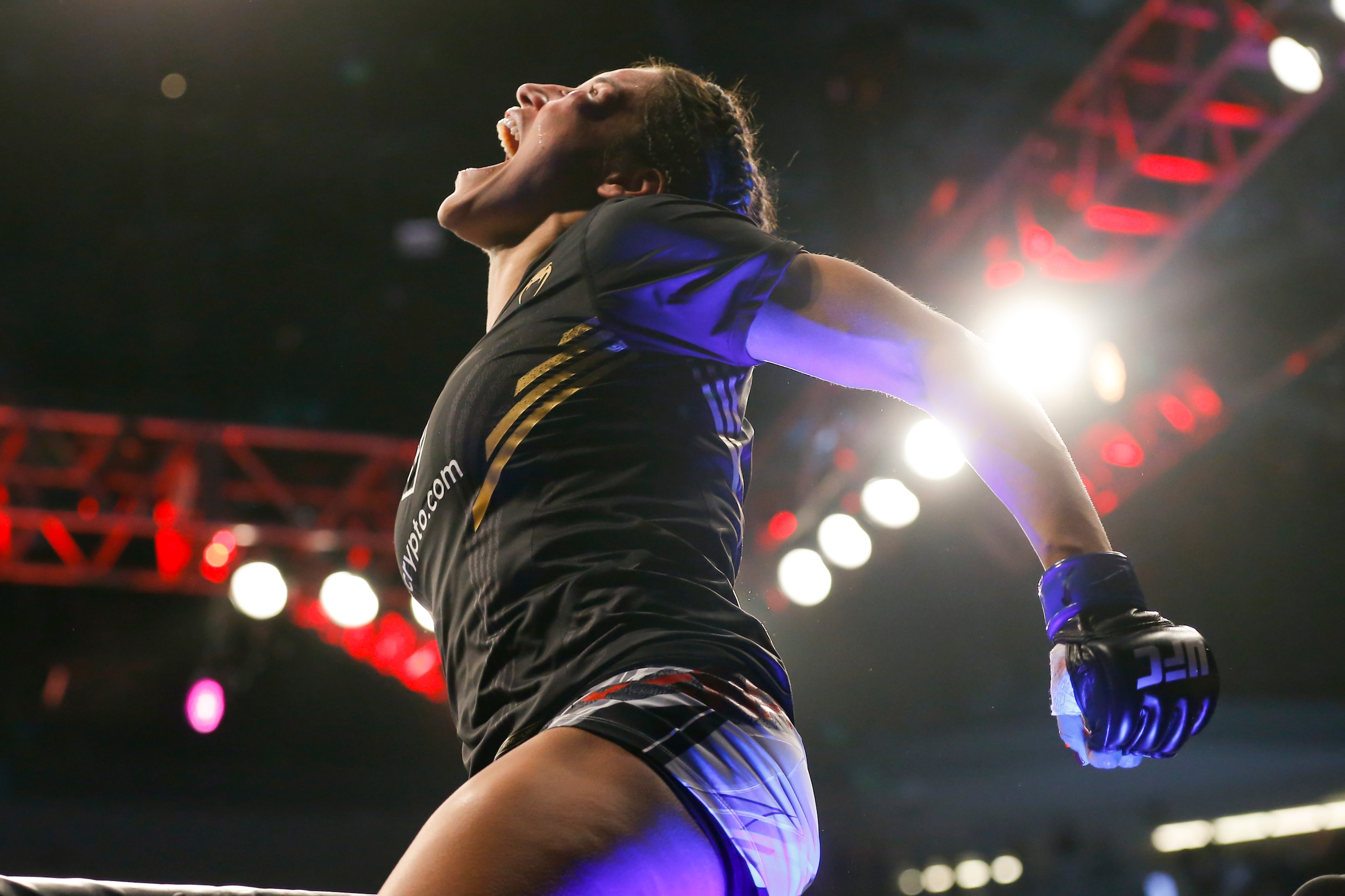 Julianna Pena reacts after defeating Amanda Nunes by submission in a women's bantamweight mixed martial arts title bout at UFC 269, Saturday, Dec. 11, 2021, in Las Vegas. (AP Photo/Chase Stevens)