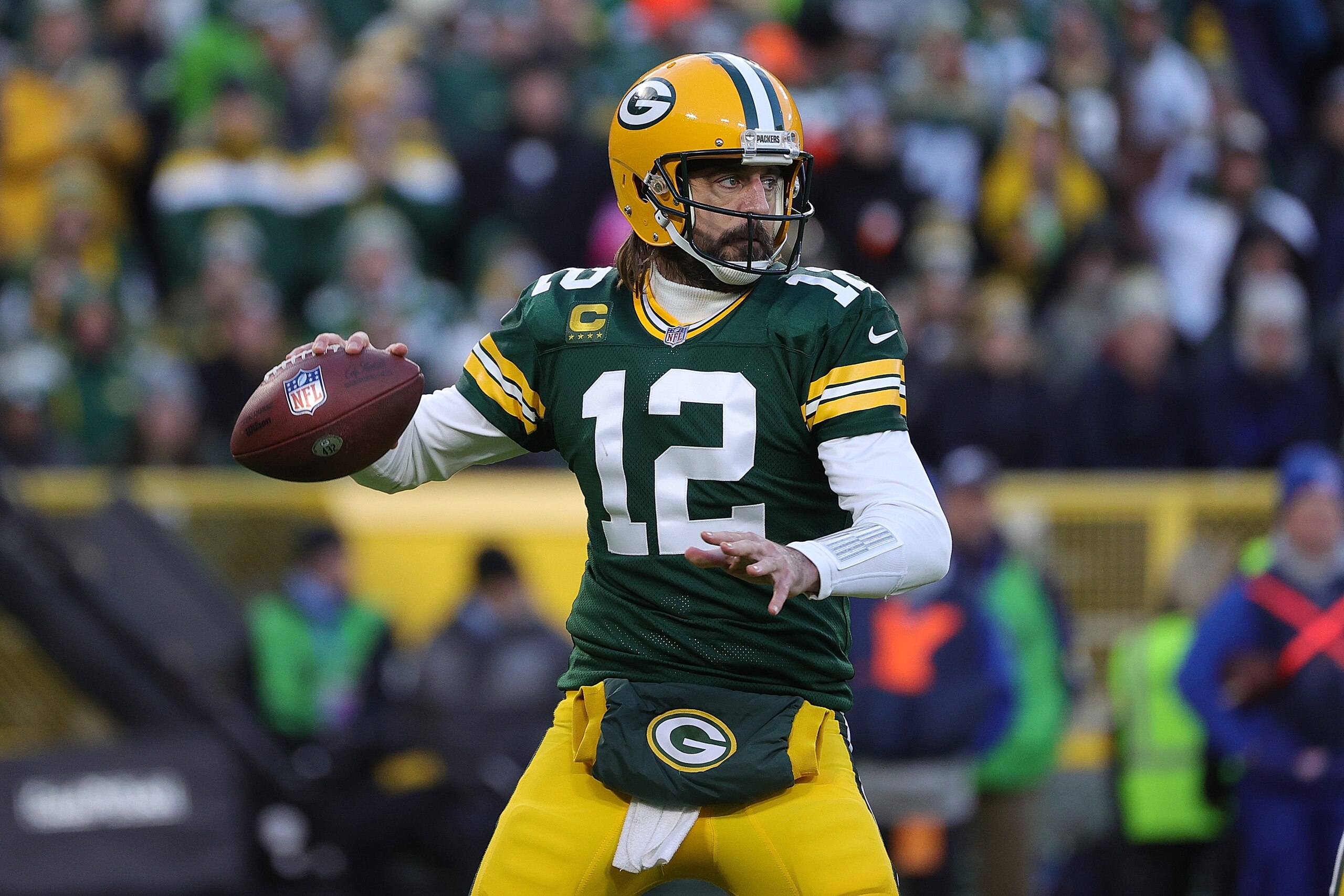 GREEN BAY, WISCONSIN - NOVEMBER 28: Aaron Rodgers #12 of the Green Bay Packers throws a pass during a game against the Los Angeles Rams at Lambeau Field on November 28, 2021 in Green Bay, Wisconsin.  The Packers defeated the Rams 36-28.   (Photo by Stacy Revere/Getty Images)
